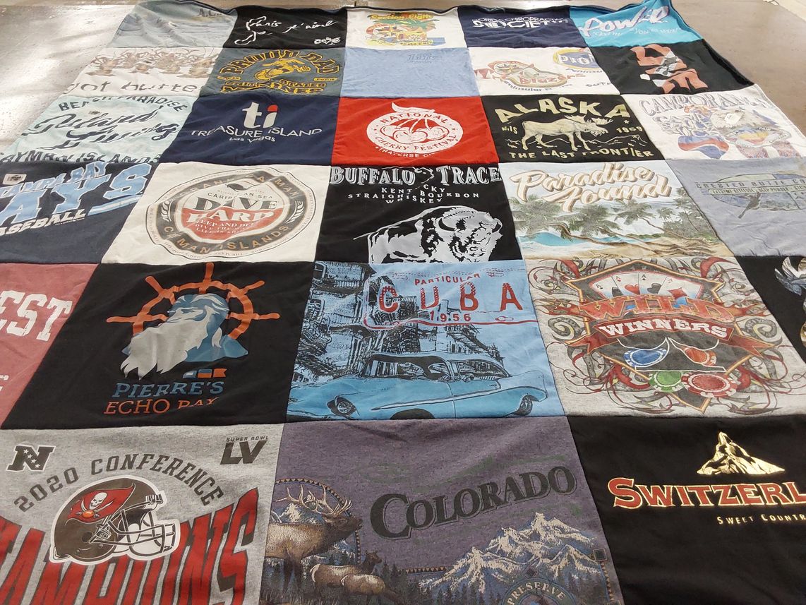 T-shirt quilt with travel, sports themes by Kathy from FL