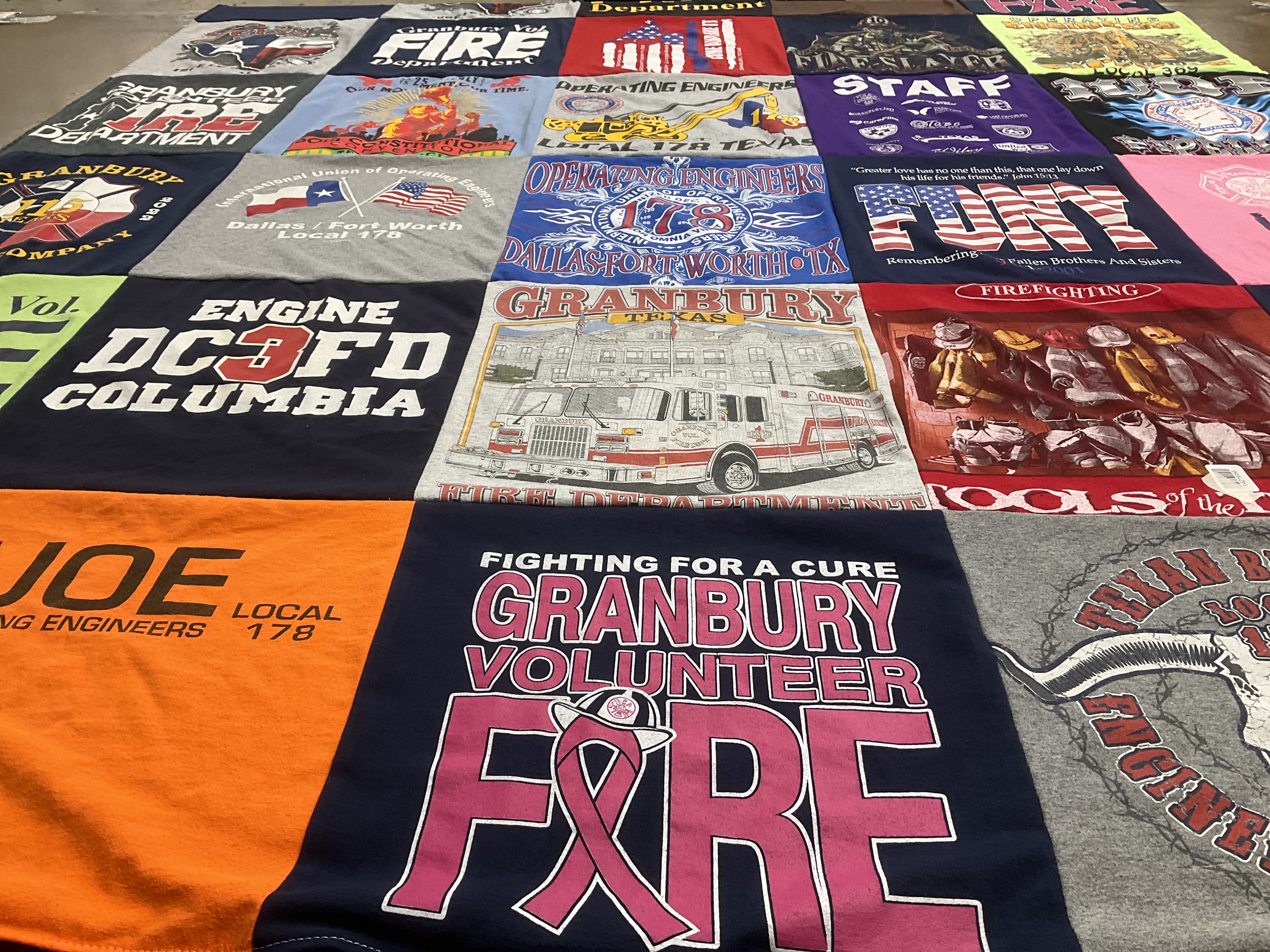 T-shirt quilt with firefighting, community service themes by Mack from TX