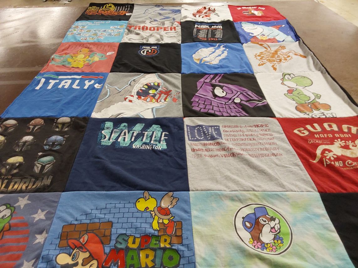 T-shirt quilt with music, video games themes by Barbara from CA