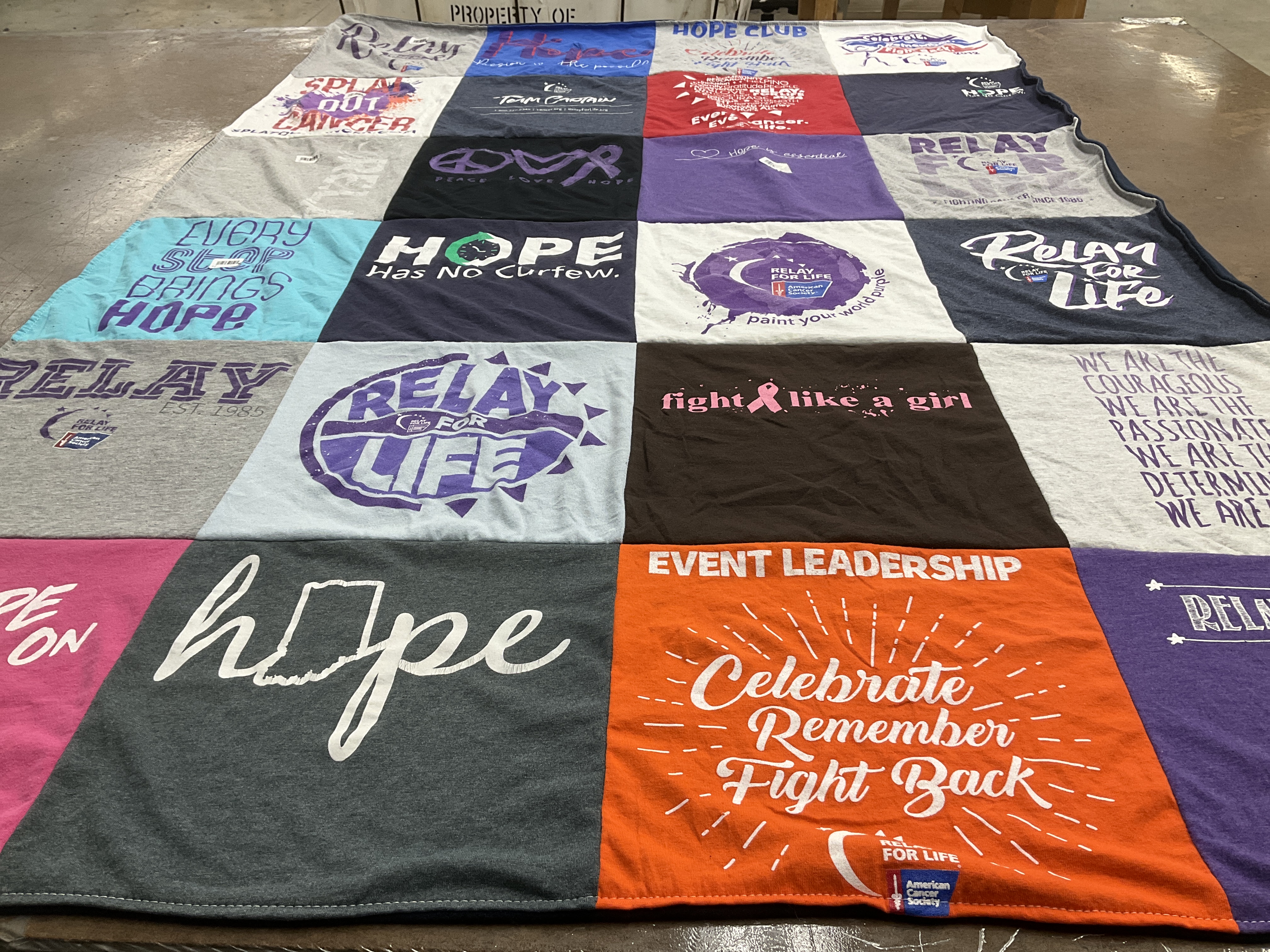 T-shirt quilt with cancer awareness, fundraising themes by Catherine from IN