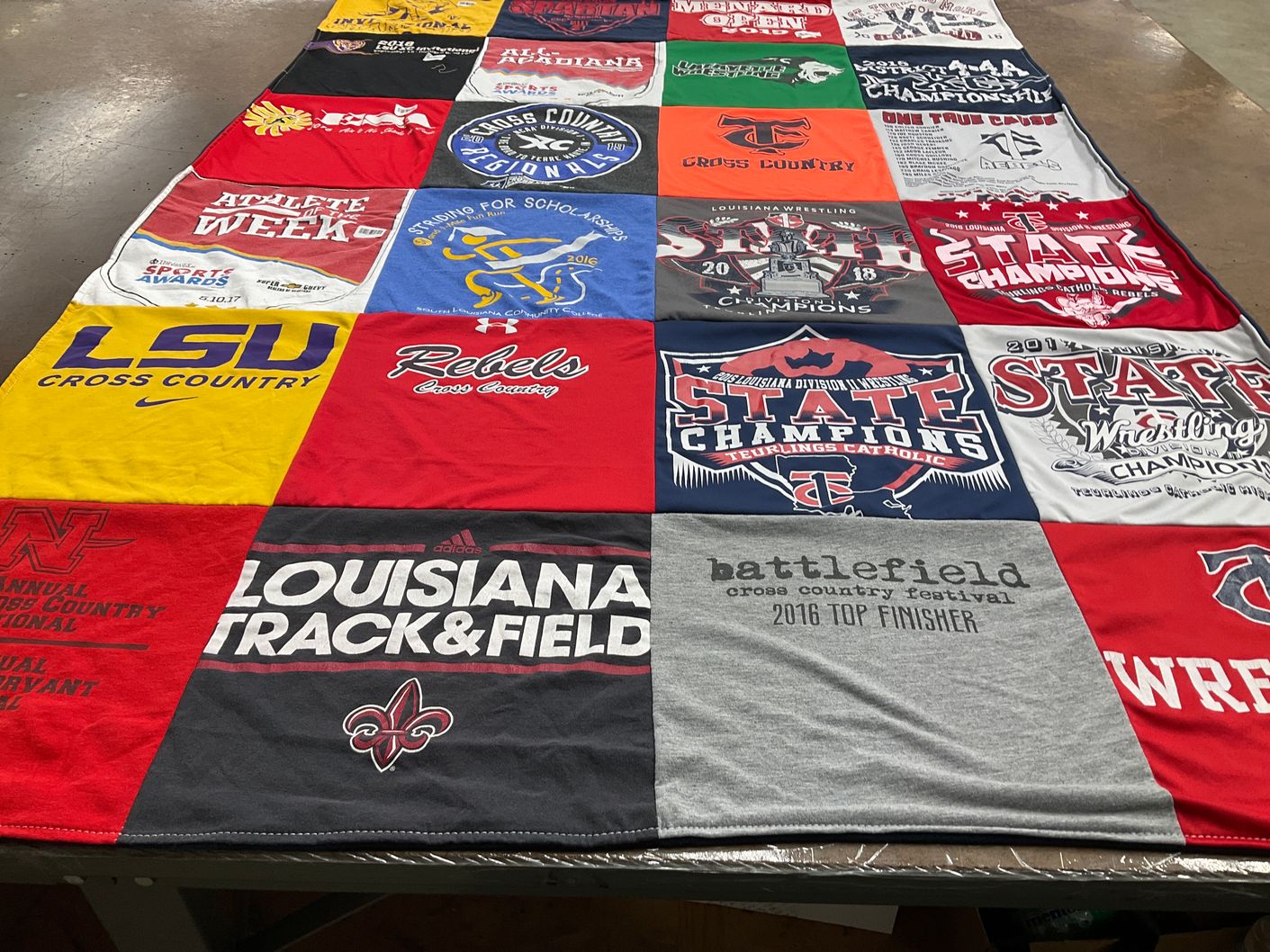 T-shirt quilt featuring louisiana rebels cross country, eurlings catholic wrestling by George from LA