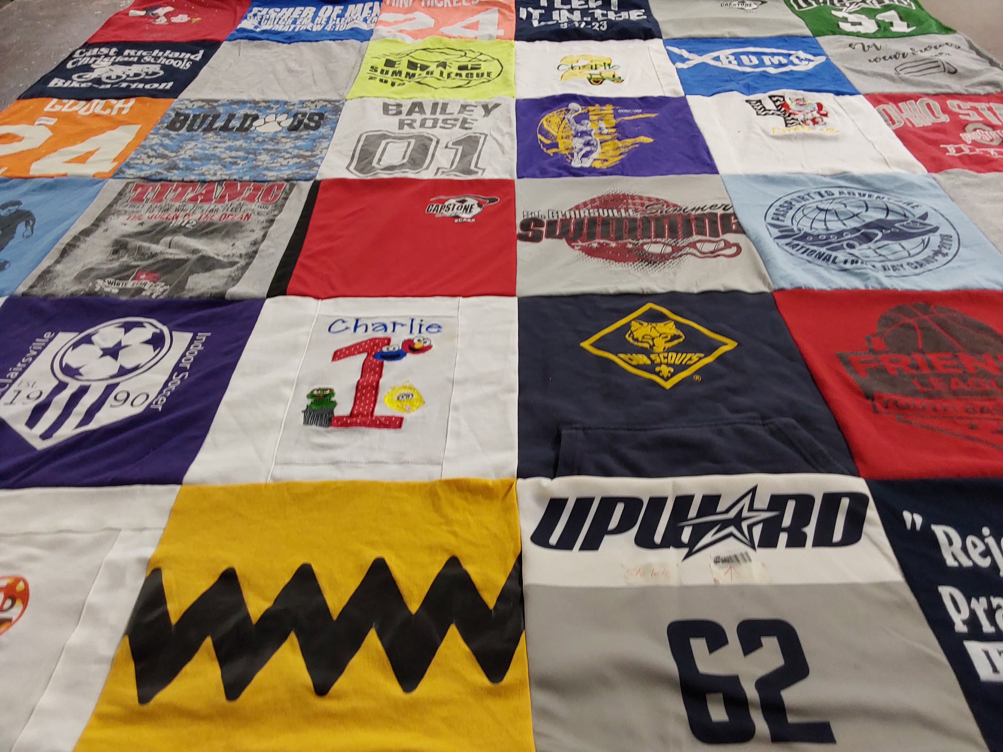 T-shirt quilt with sports, swimming themes by Jennifer from OH