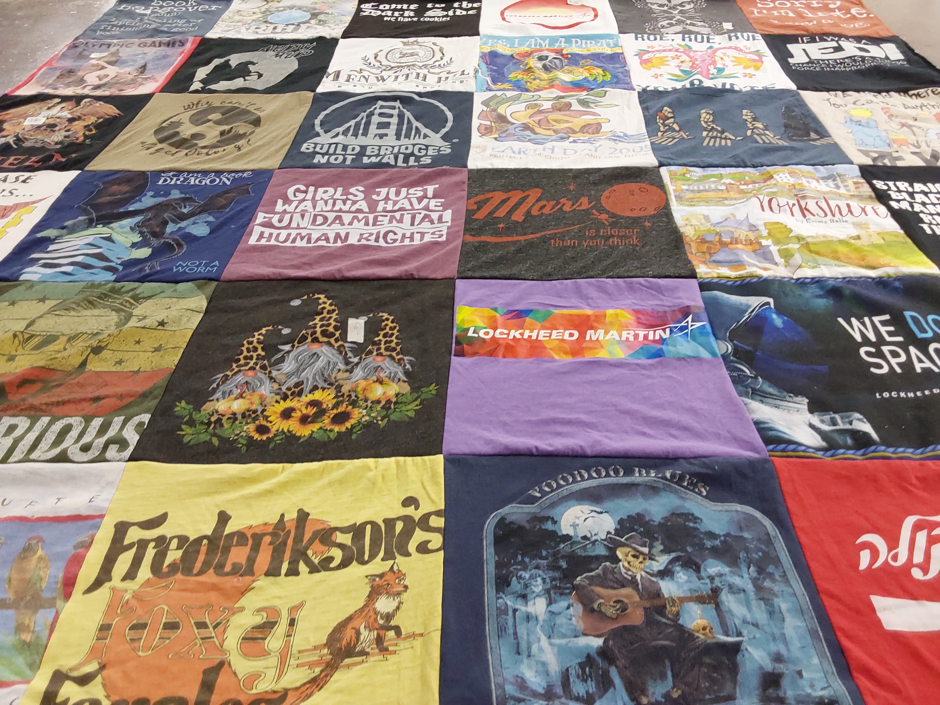 T-shirt quilt with human rights, environment themes by Sonia from CO