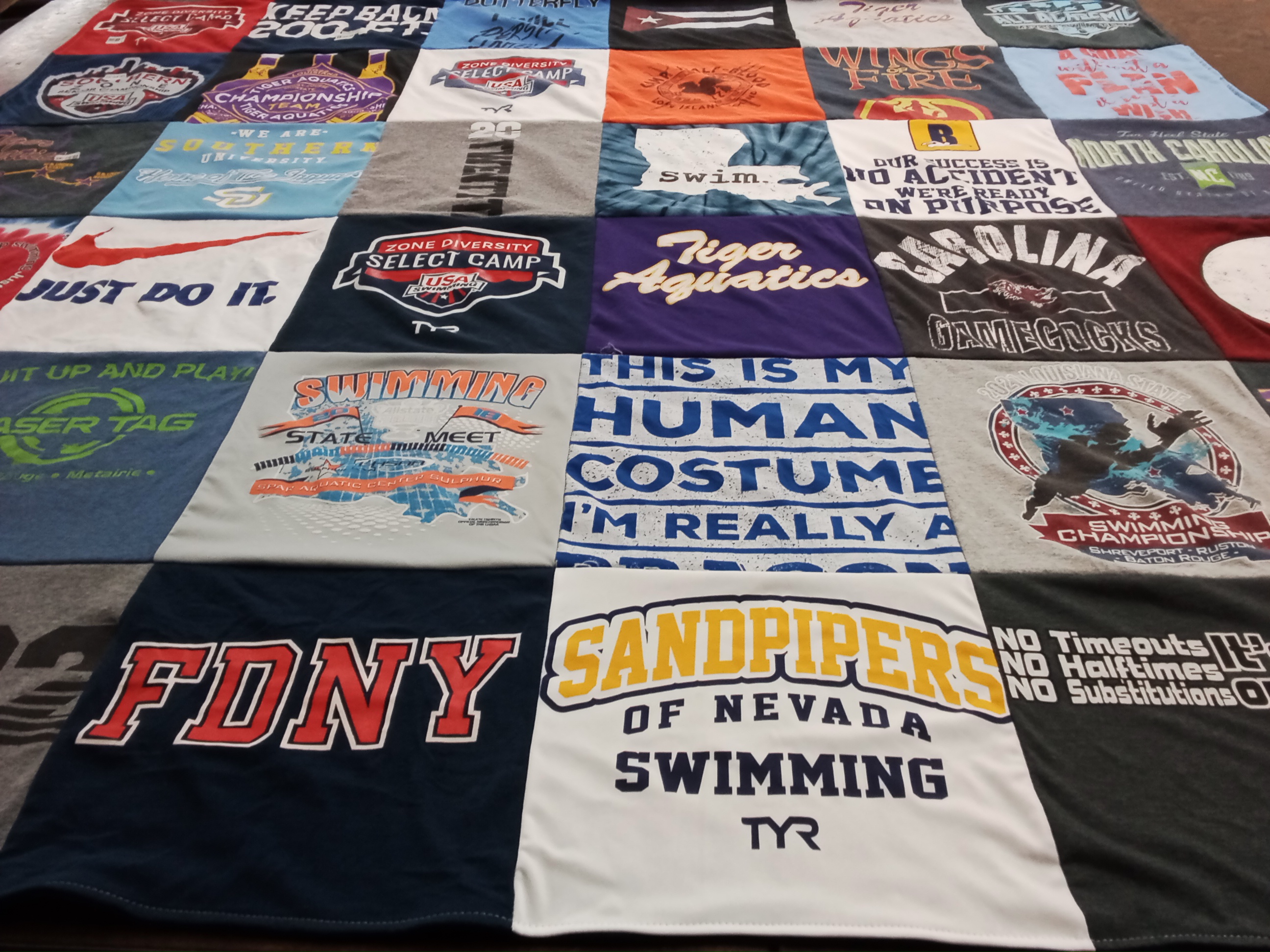 T-shirt quilt featuring tiger aquatics, sandpipers of nevada swimming by Jennifer from LA