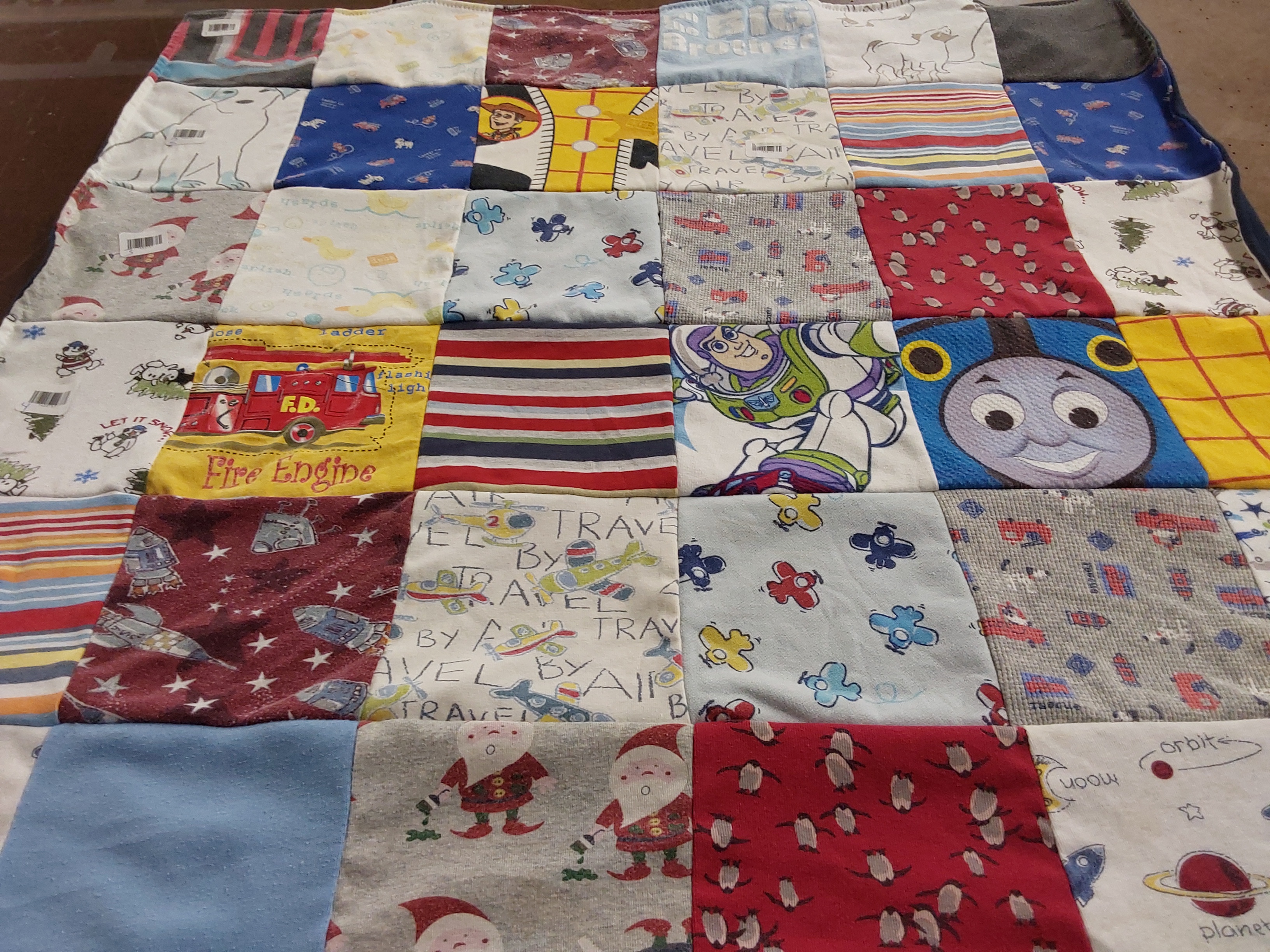 T-shirt quilt with space, firefighting themes by Brian from TX