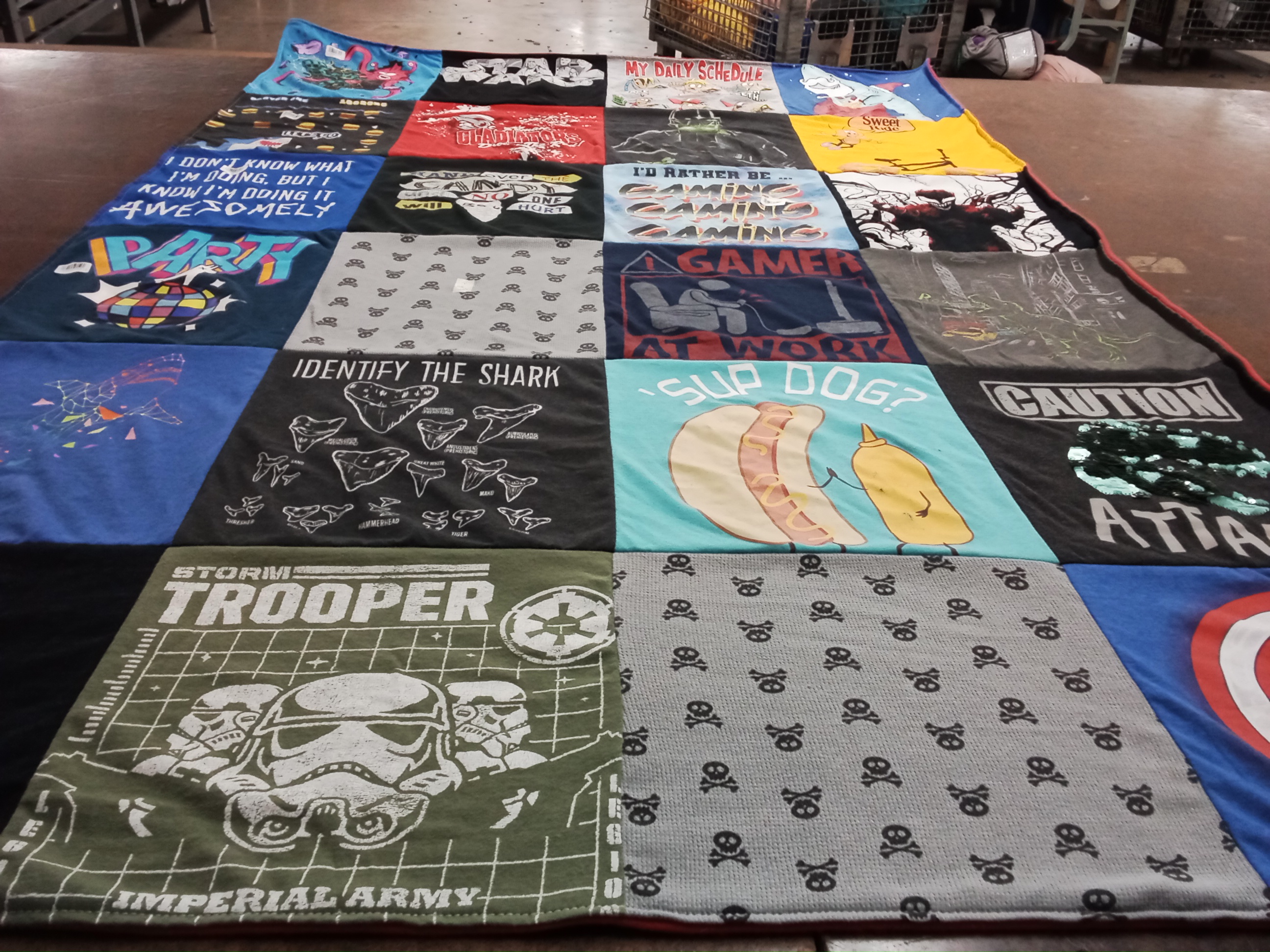 T-shirt quilt with gaming, sharks themes by Rebecca from WI
