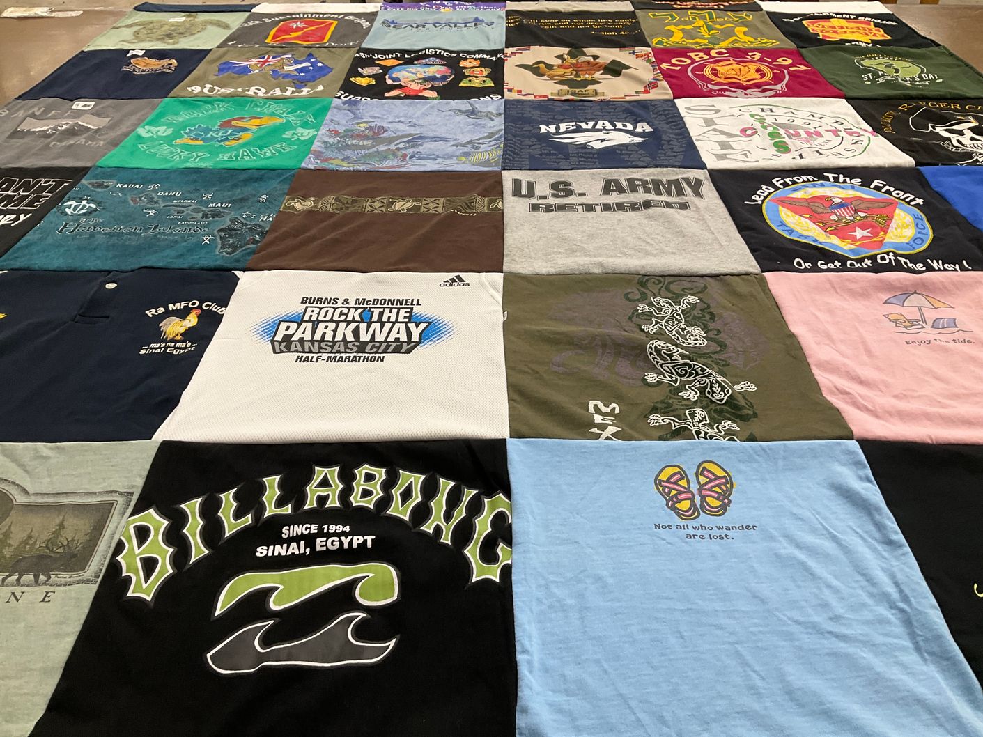 T-shirt quilt with running, traveling themes by Christine from MT