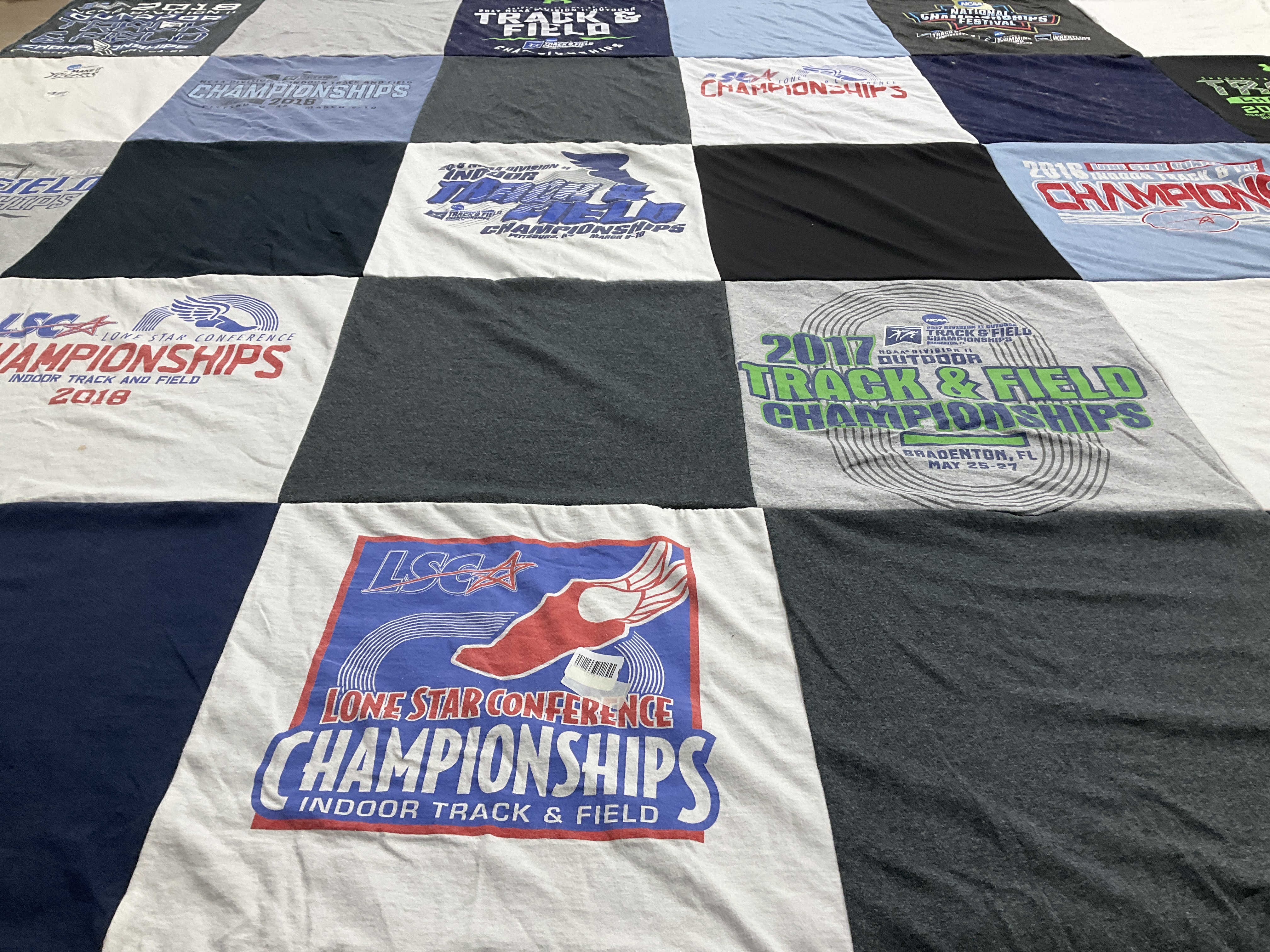 T-shirt quilt with athletics, sports themes by Amber from TX