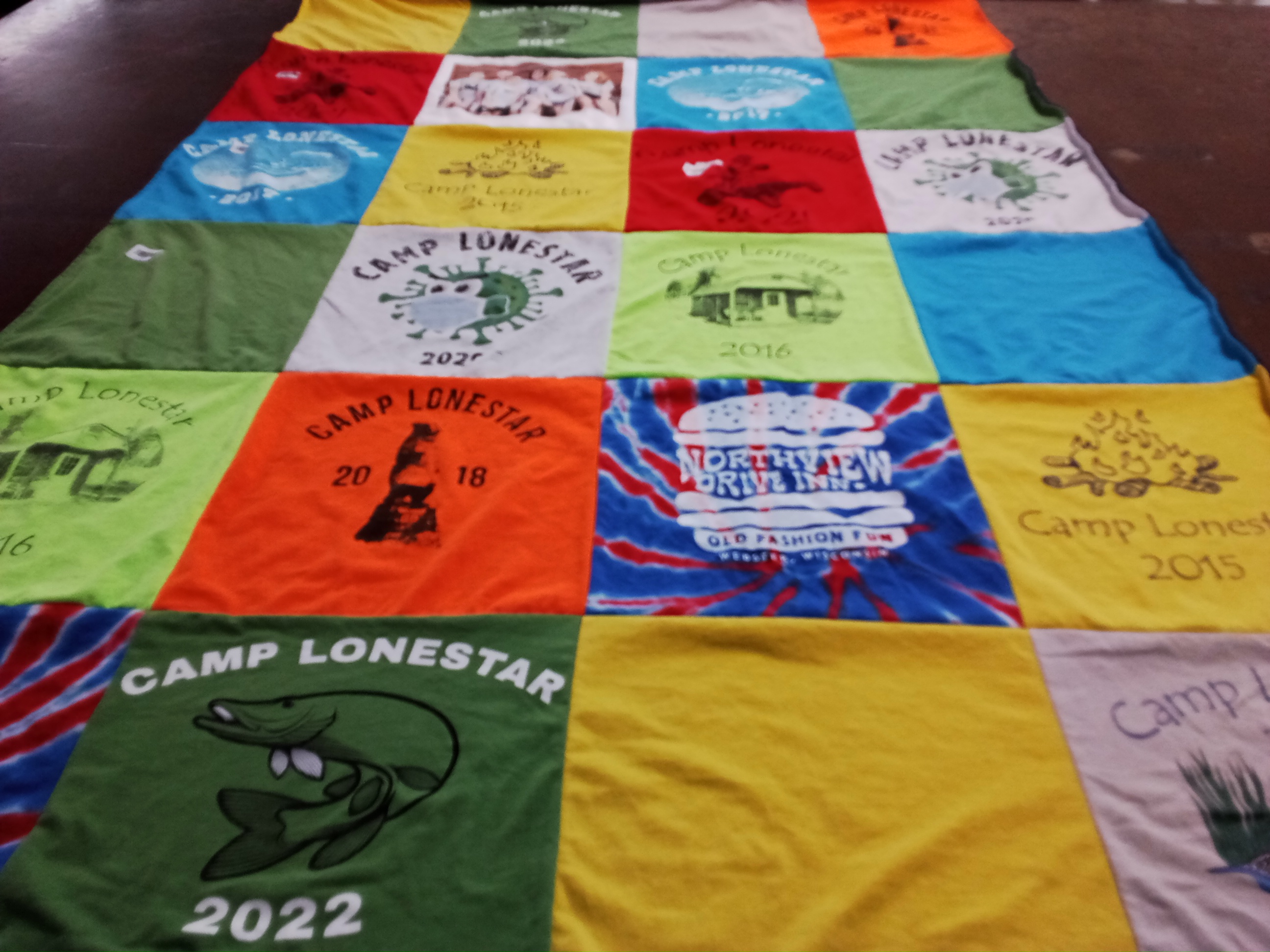 T-shirt quilt with camping, outdoor activities themes by Kelly from MN