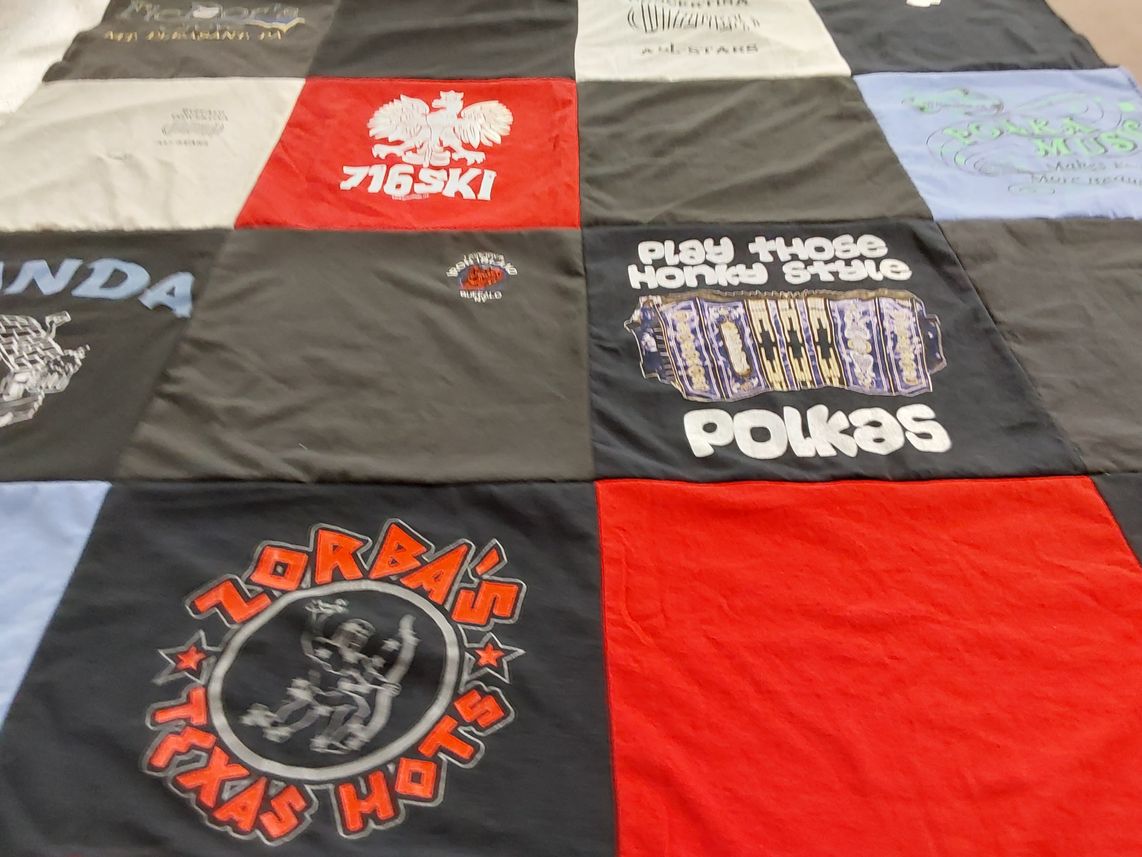 T-shirt quilt with skiing, music themes by Jill from NY