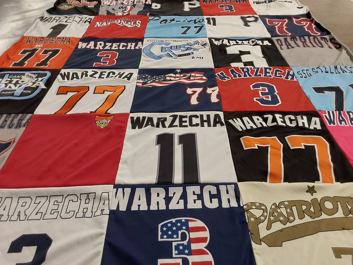 T-shirt quilt with sports, team activities themes by April from MI