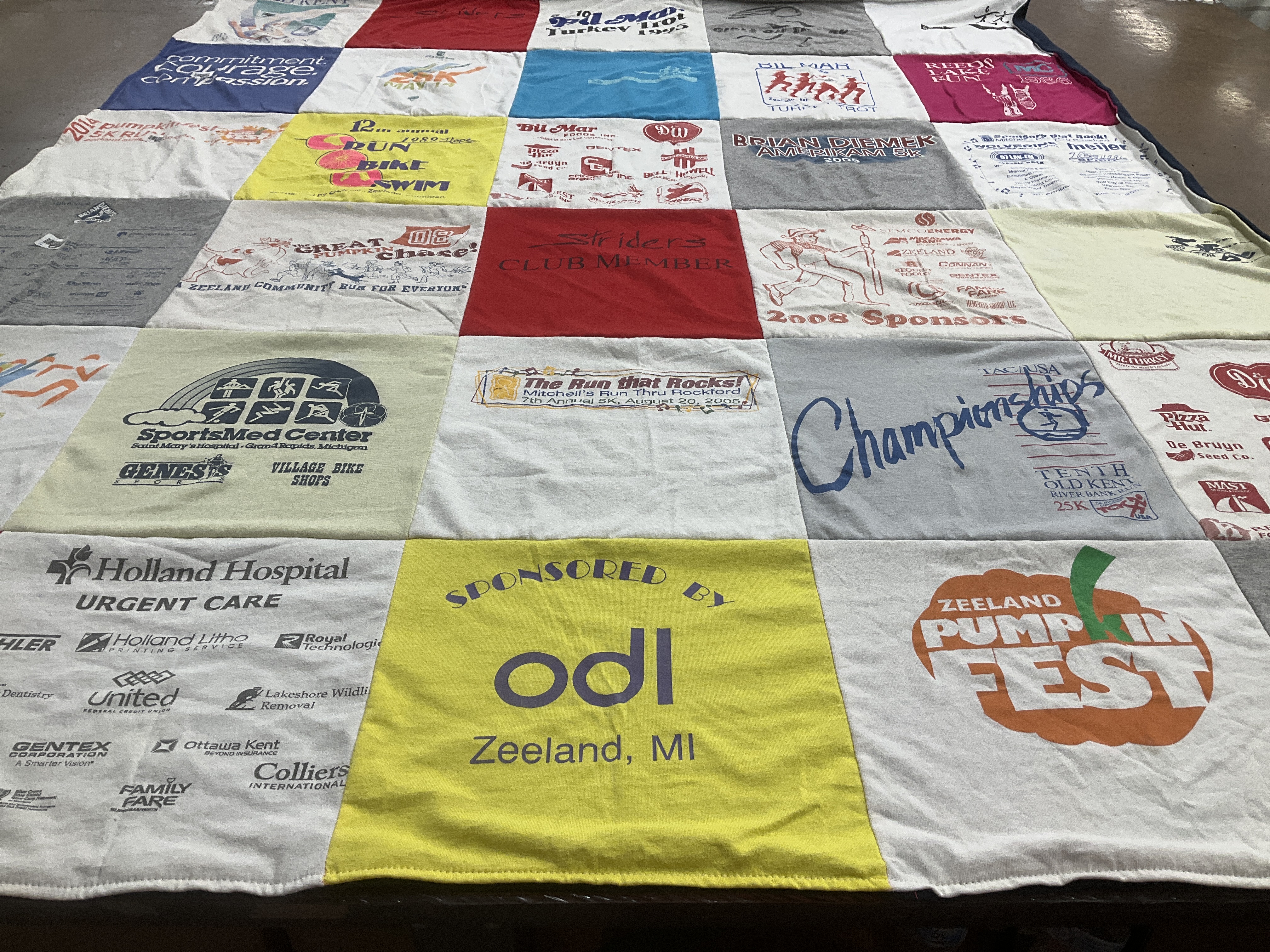 T-shirt quilt with running, community events themes by Sonia from MI