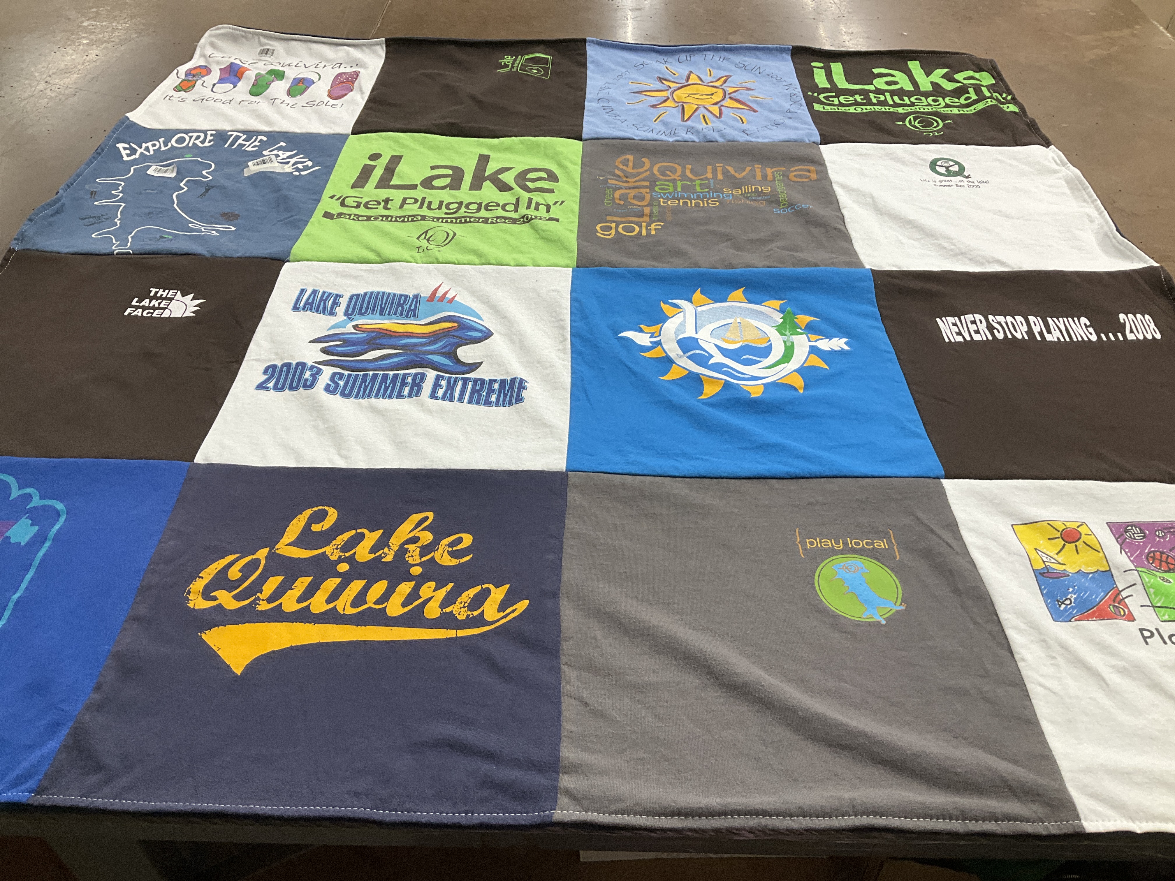 T-shirt quilt with boating, golf themes by Susan from KS