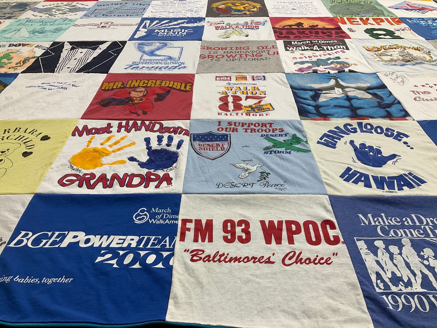T-shirt quilt with community support, family themes by Amy from MD
