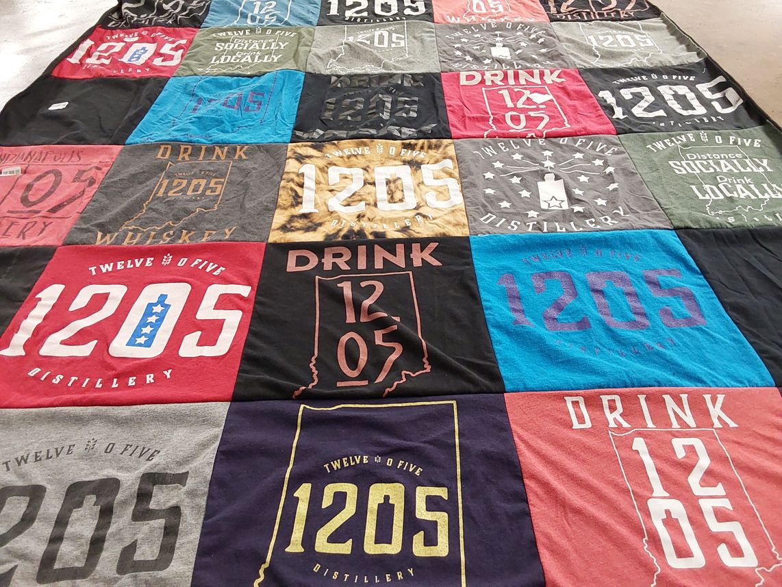 T-shirt quilt with craft beverages, distilleries themes by Megan from IN