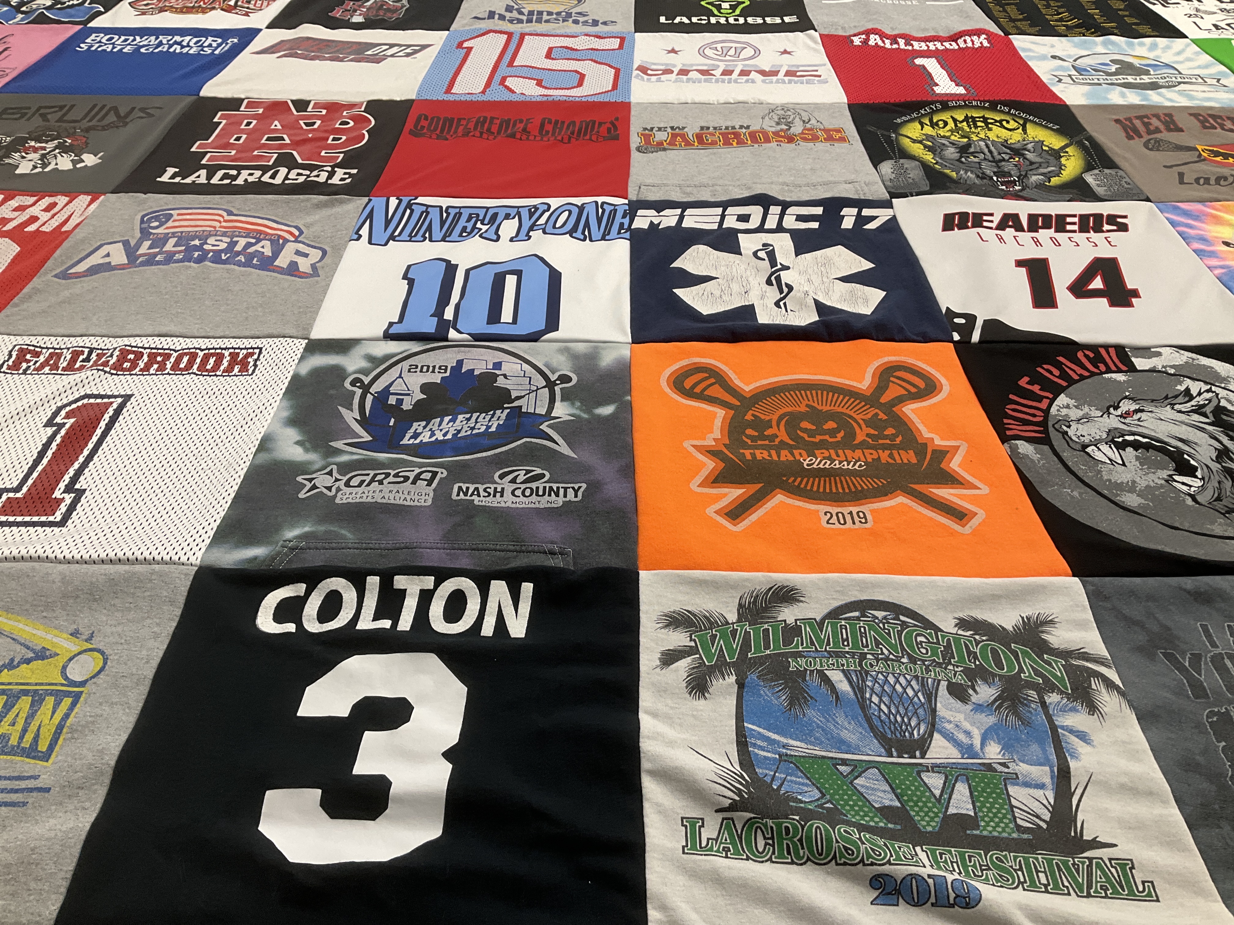 T-shirt quilt with lacrosse, sports themes by Gerri from OH