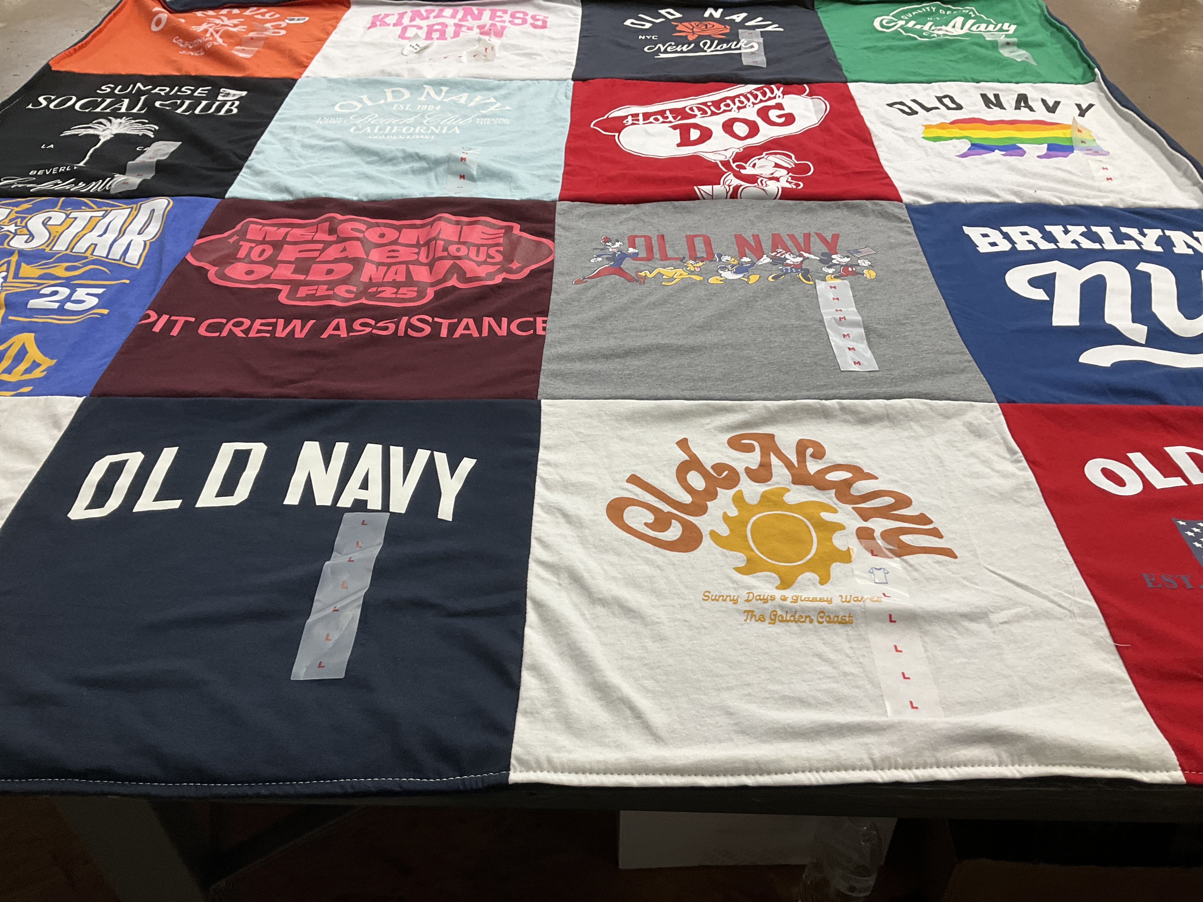 T-shirt quilt with shopping, fashion themes by Rebecca from CA