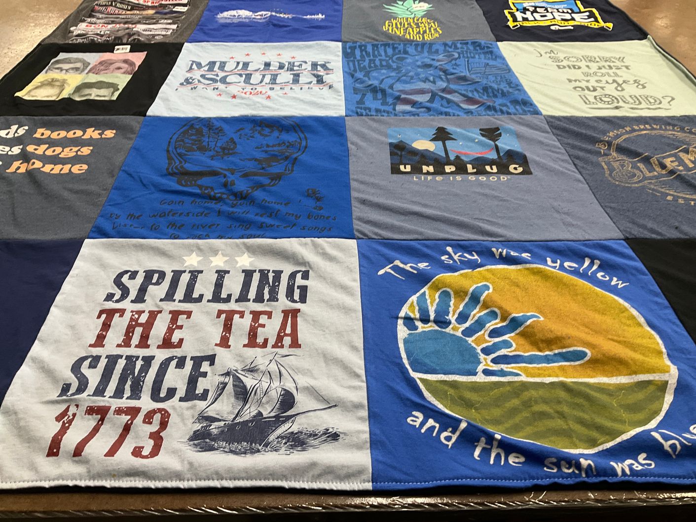 T-shirt quilt with reading, music themes by Jennifer from IL