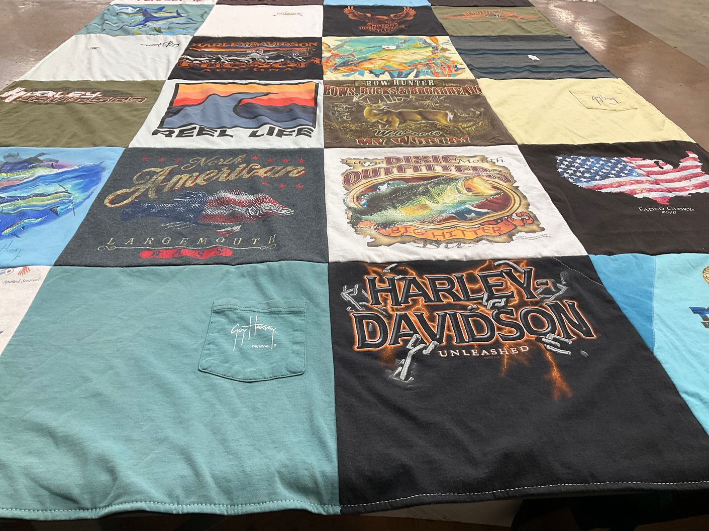 T-shirt quilt with fishing, motorcycles themes by Deborah Lee from IN