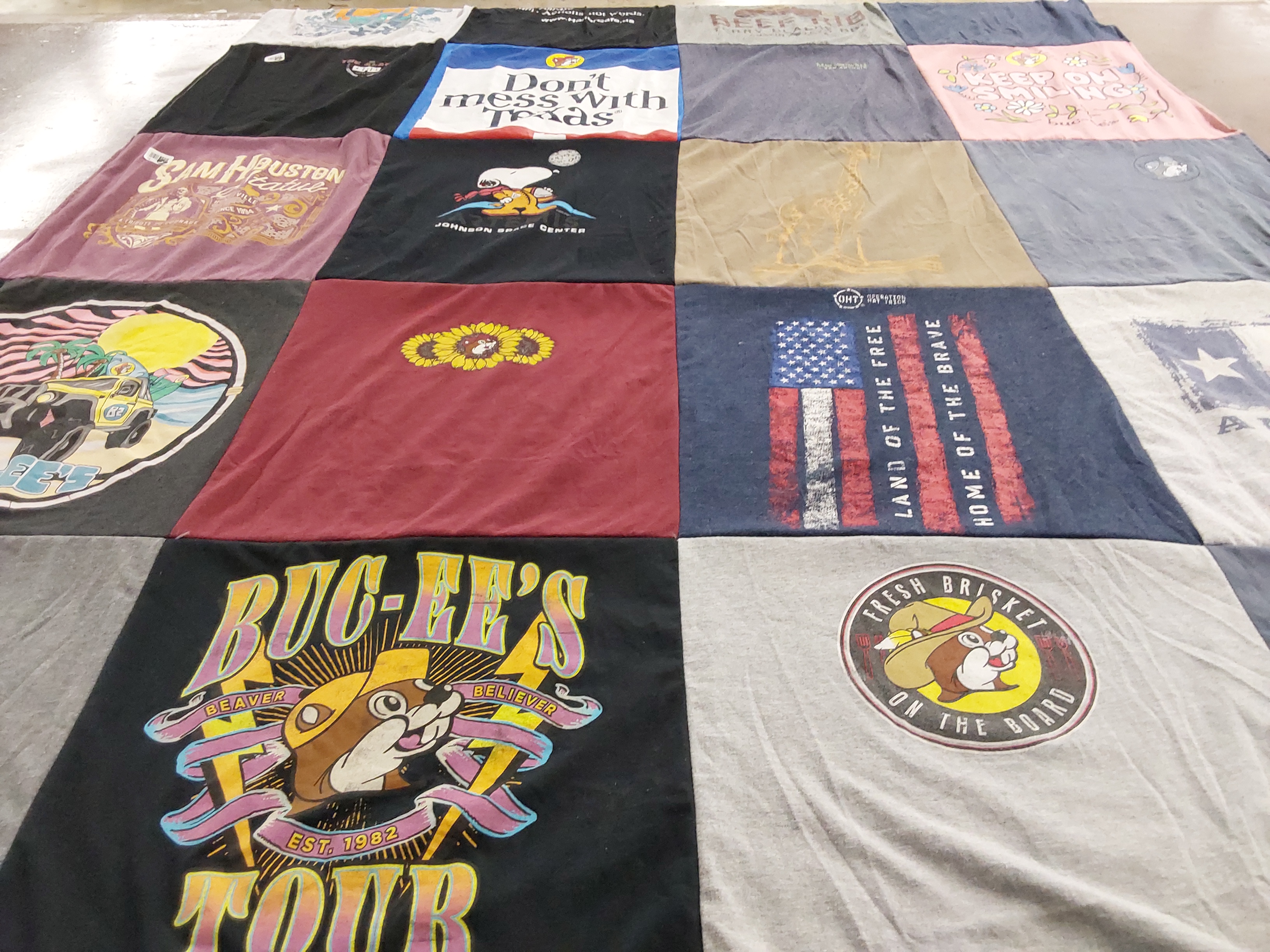 T-shirt quilt with travel, texas culture themes by cheryl from CA