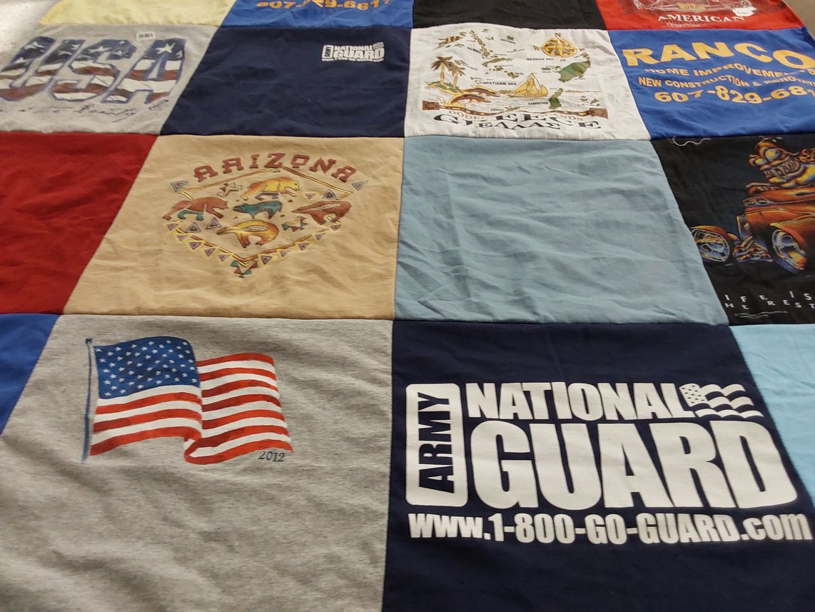 T-shirt quilt with military, travel themes by Debra from NY
