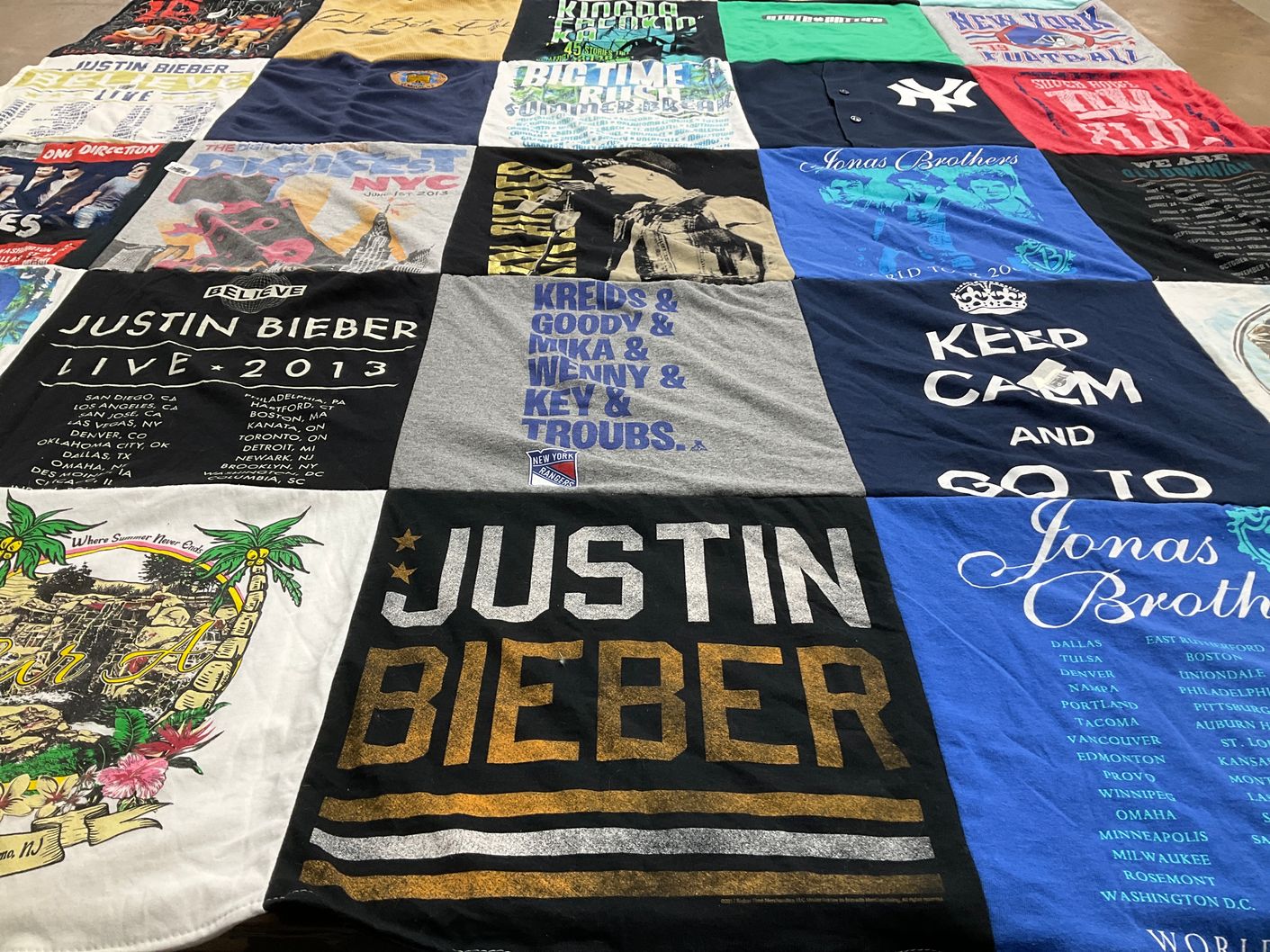 T-shirt quilt with music, concerts themes by Julia from NJ