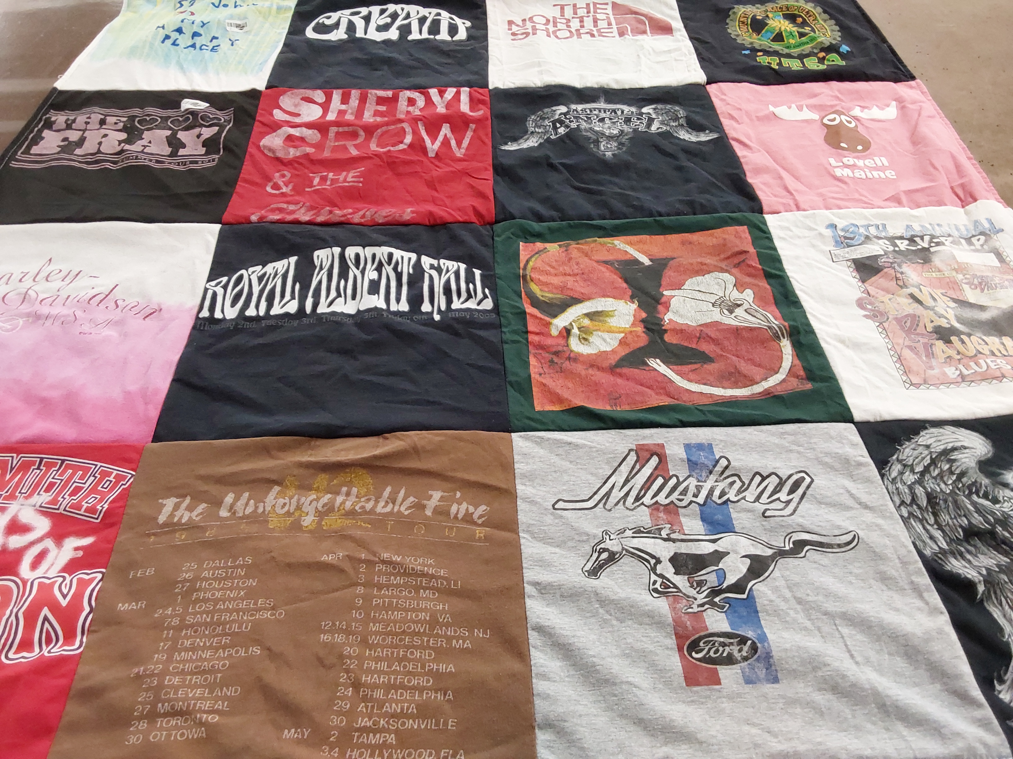 T-shirt quilt with music, travel themes by Susan from MA
