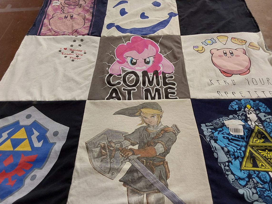 T-shirt quilt with gaming, anime themes by Patricia from IL