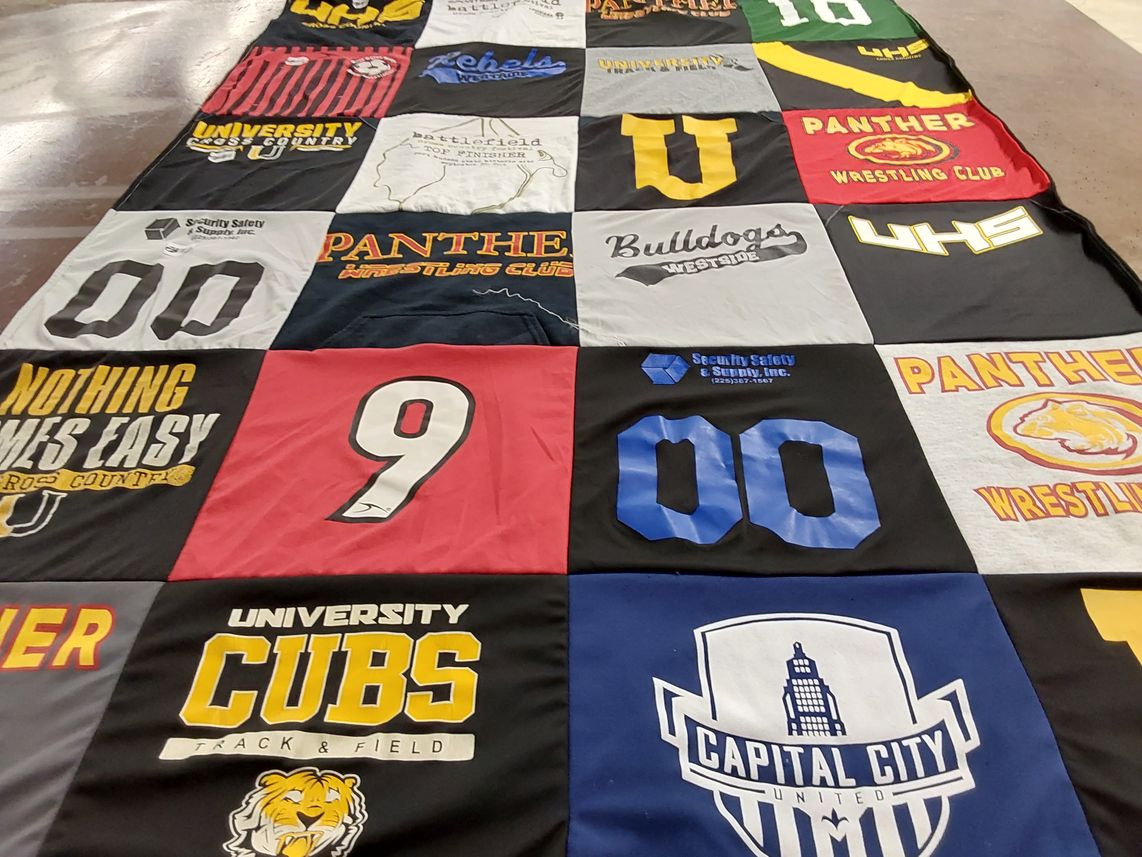 T-shirt quilt featuring university cubs track and field, panther wrestling club by Jamie from LA