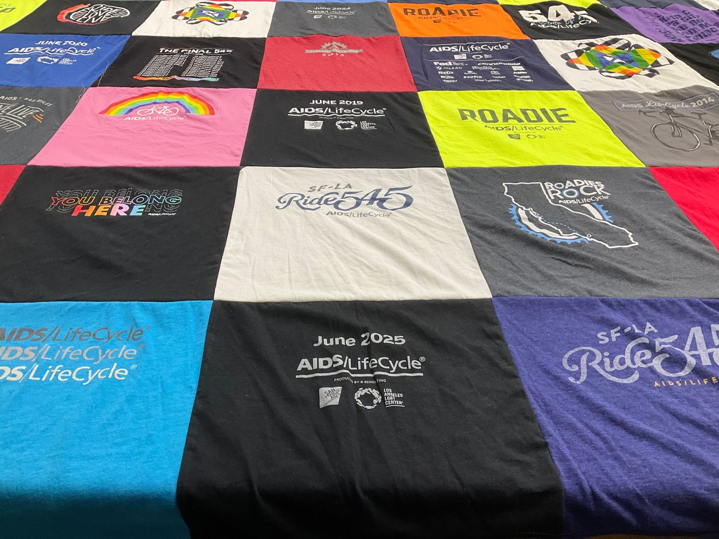 T-shirt quilt with biking, health themes by MICHELLE from CA