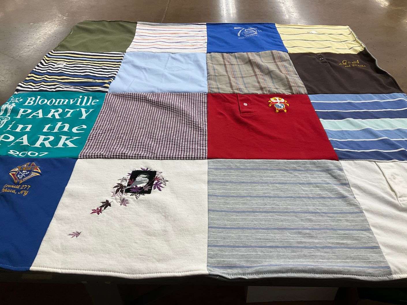 T-shirt quilt with outdoor events, community gatherings themes by Laura from NY