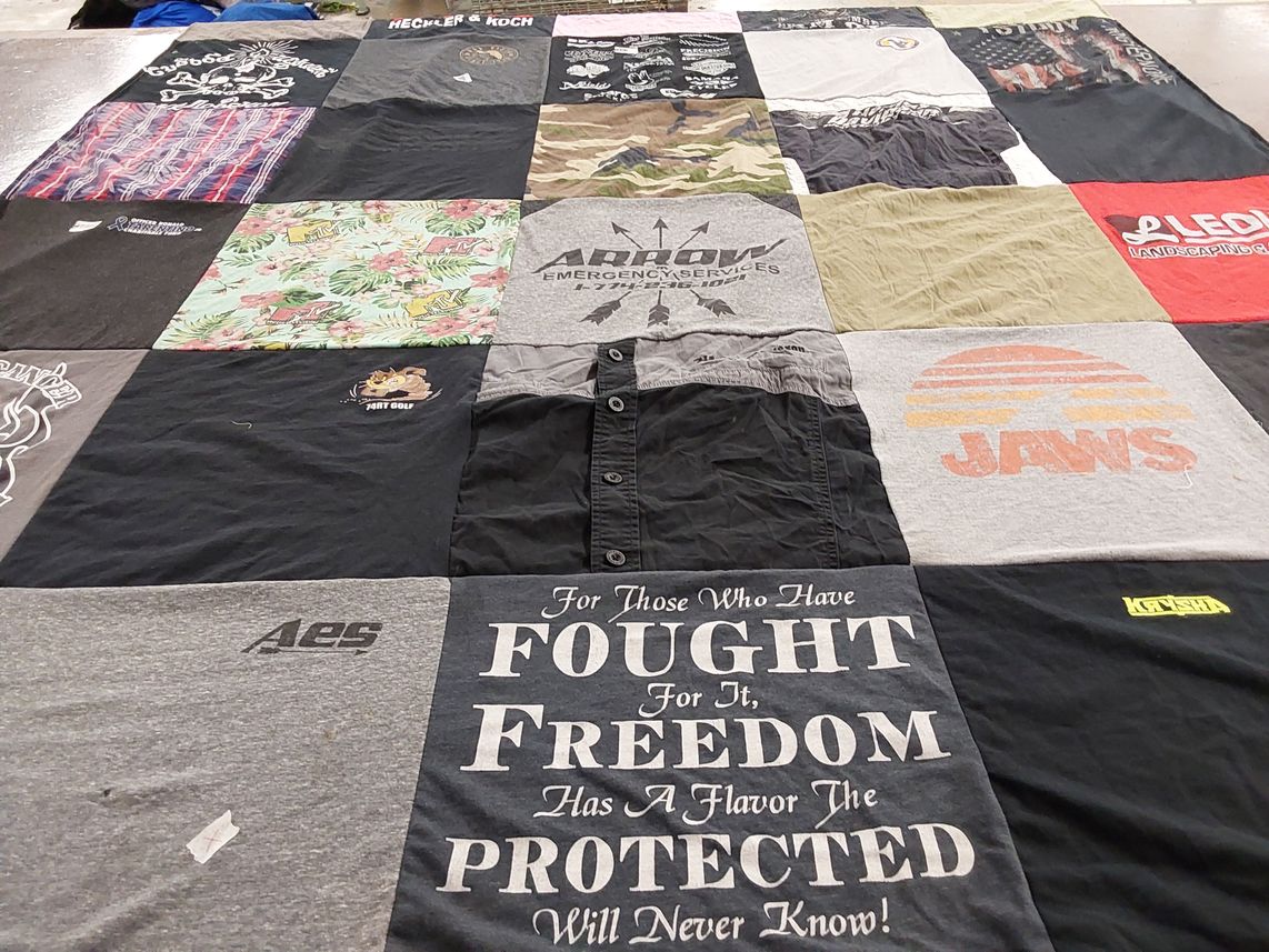 T-shirt quilt with golf, landscaping themes by Carey from MA