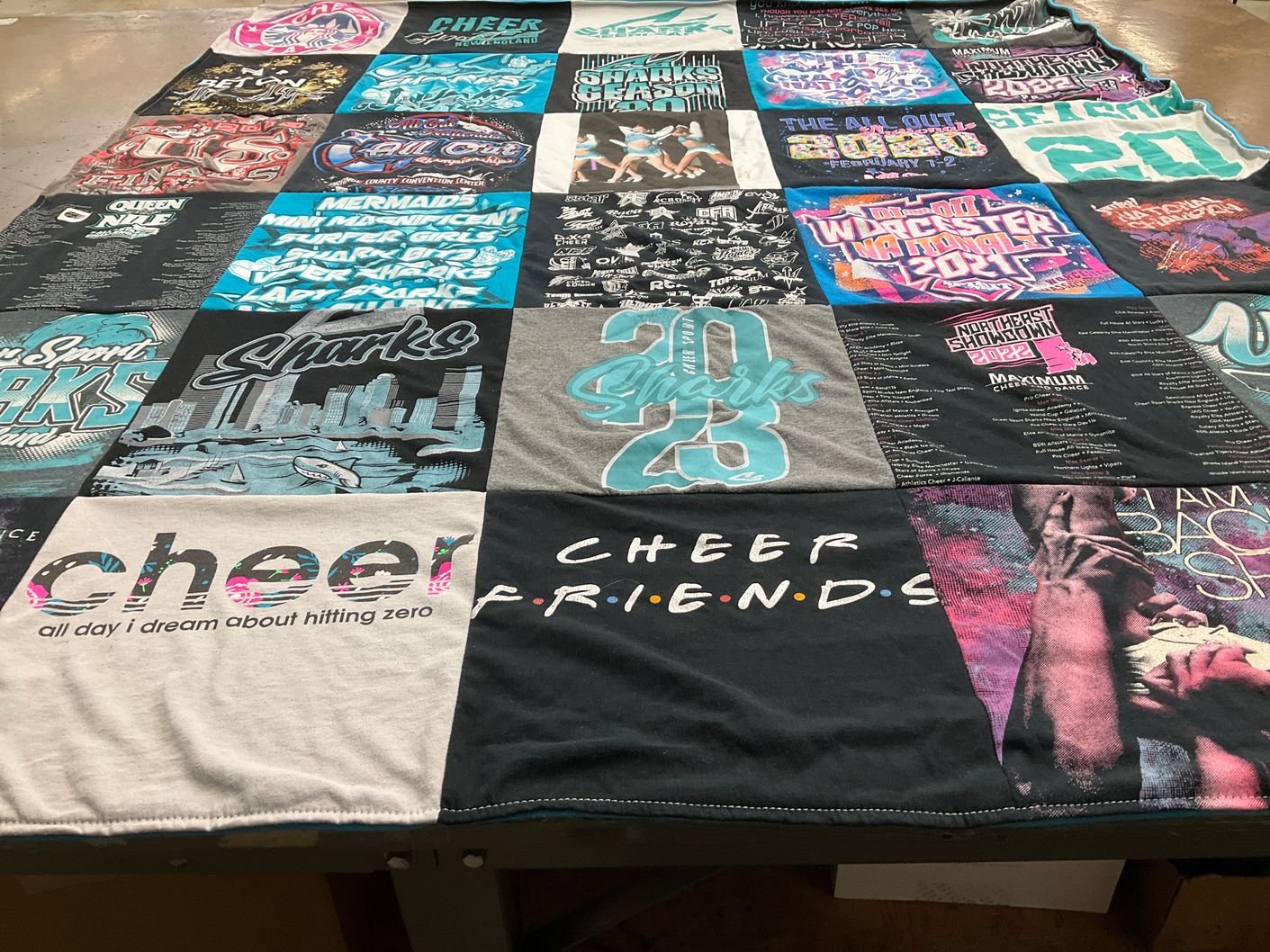 T-shirt quilt with cheerleading, sports themes by Rachel from MA