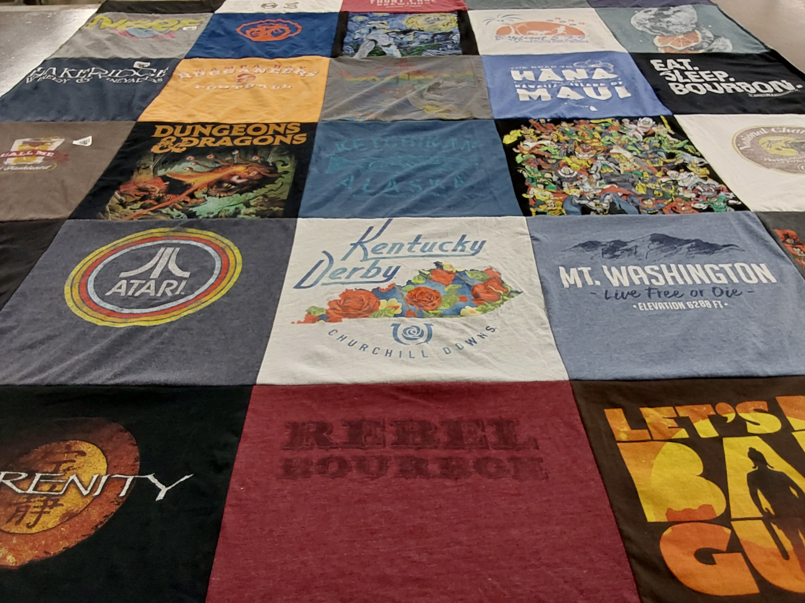 T-shirt quilt with gaming, bourbon themes by Erin from FL