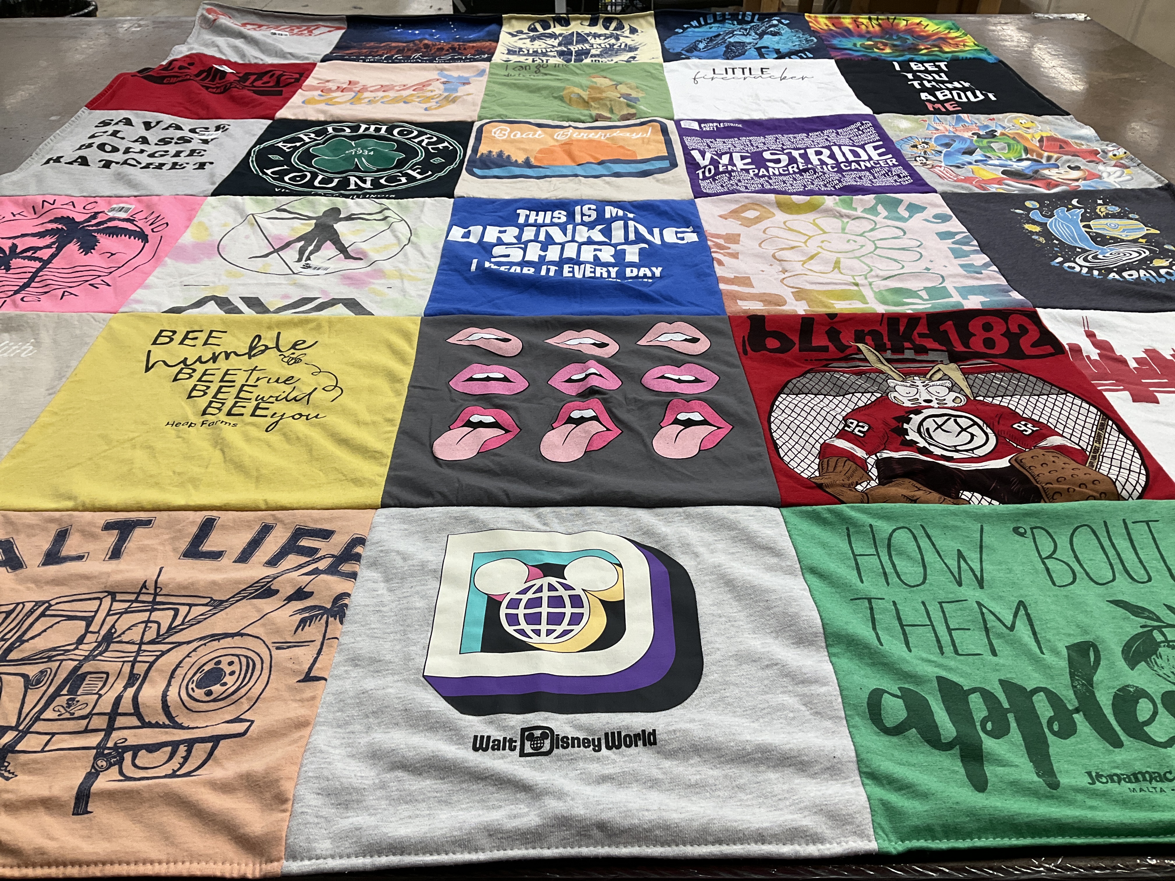 Custom Project Repat t-shirt quilt highlighting music, travel themes.