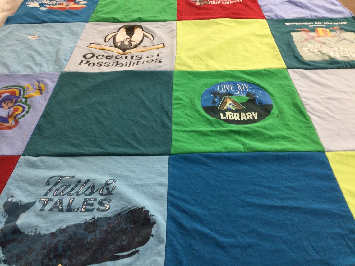 T-shirt quilt with reading, libraries themes by Rebecca from KS