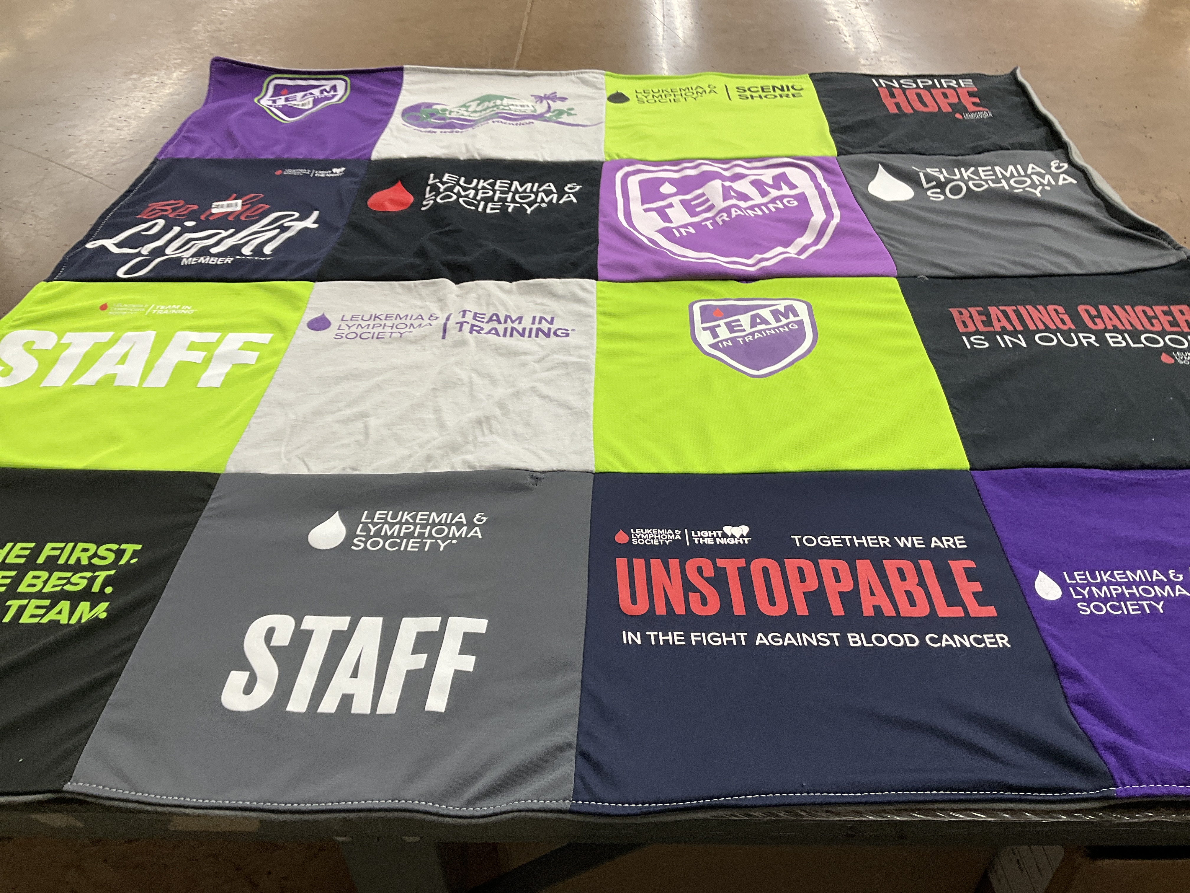 T-shirt quilt with fundraising, cancer awareness themes by amanda from FL