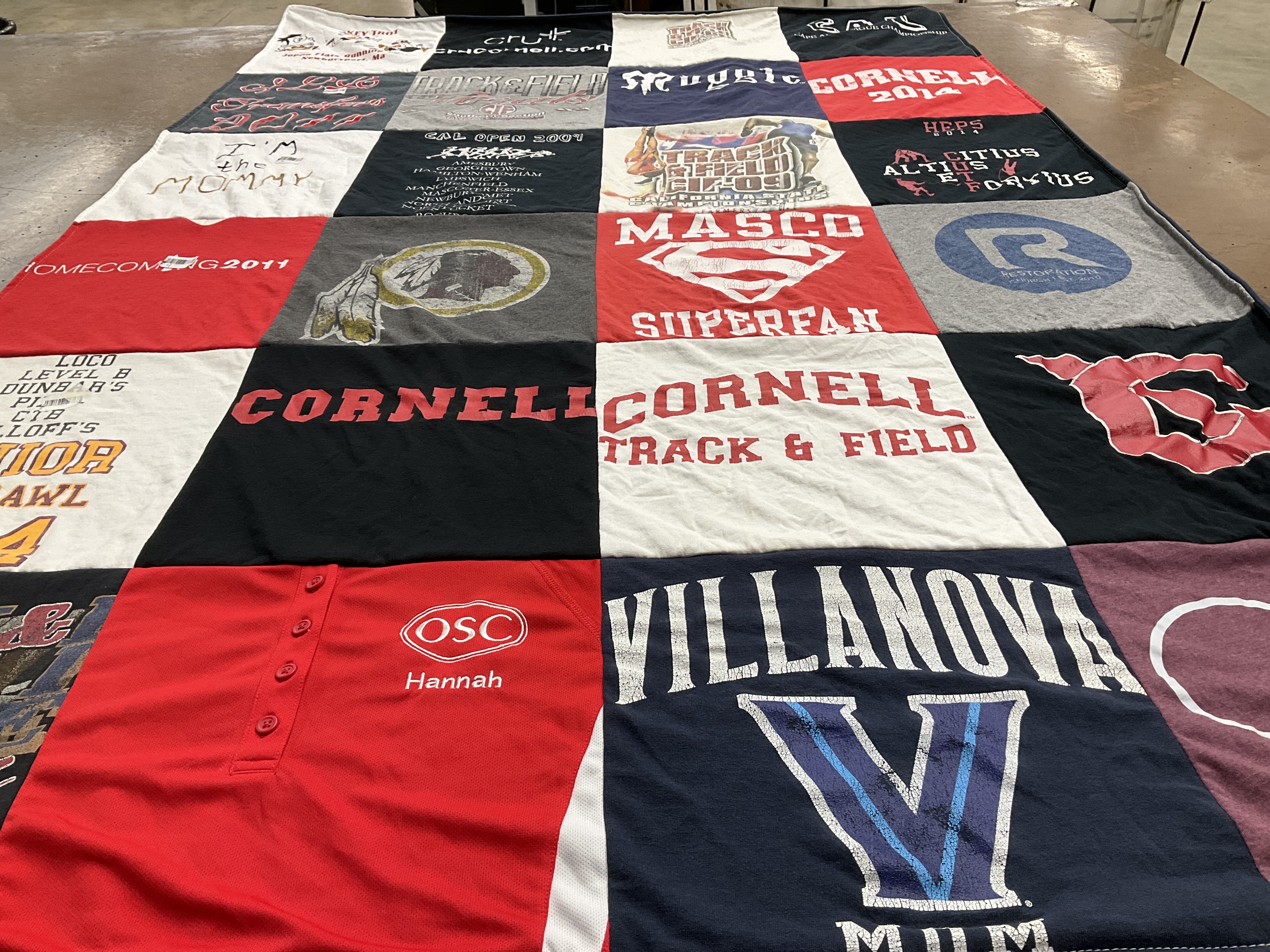 Custom Project Repat t-shirt quilt featuring shirts from cornell university, villanova university.