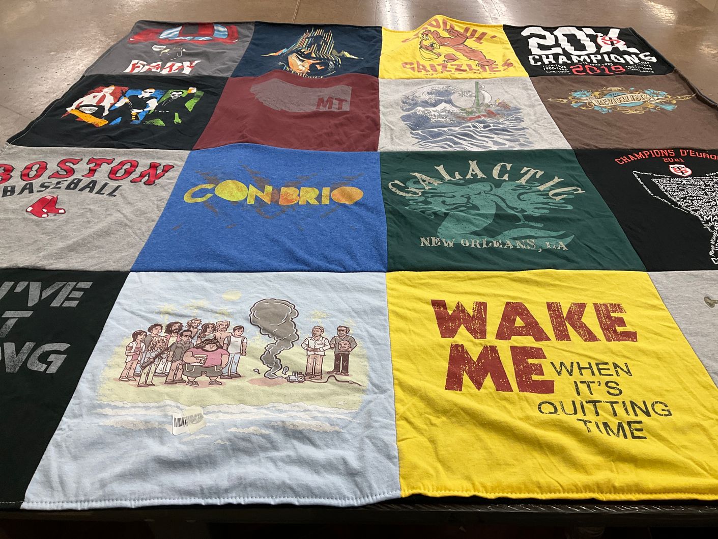 T-shirt quilt with sports, music themes by Remy from CO