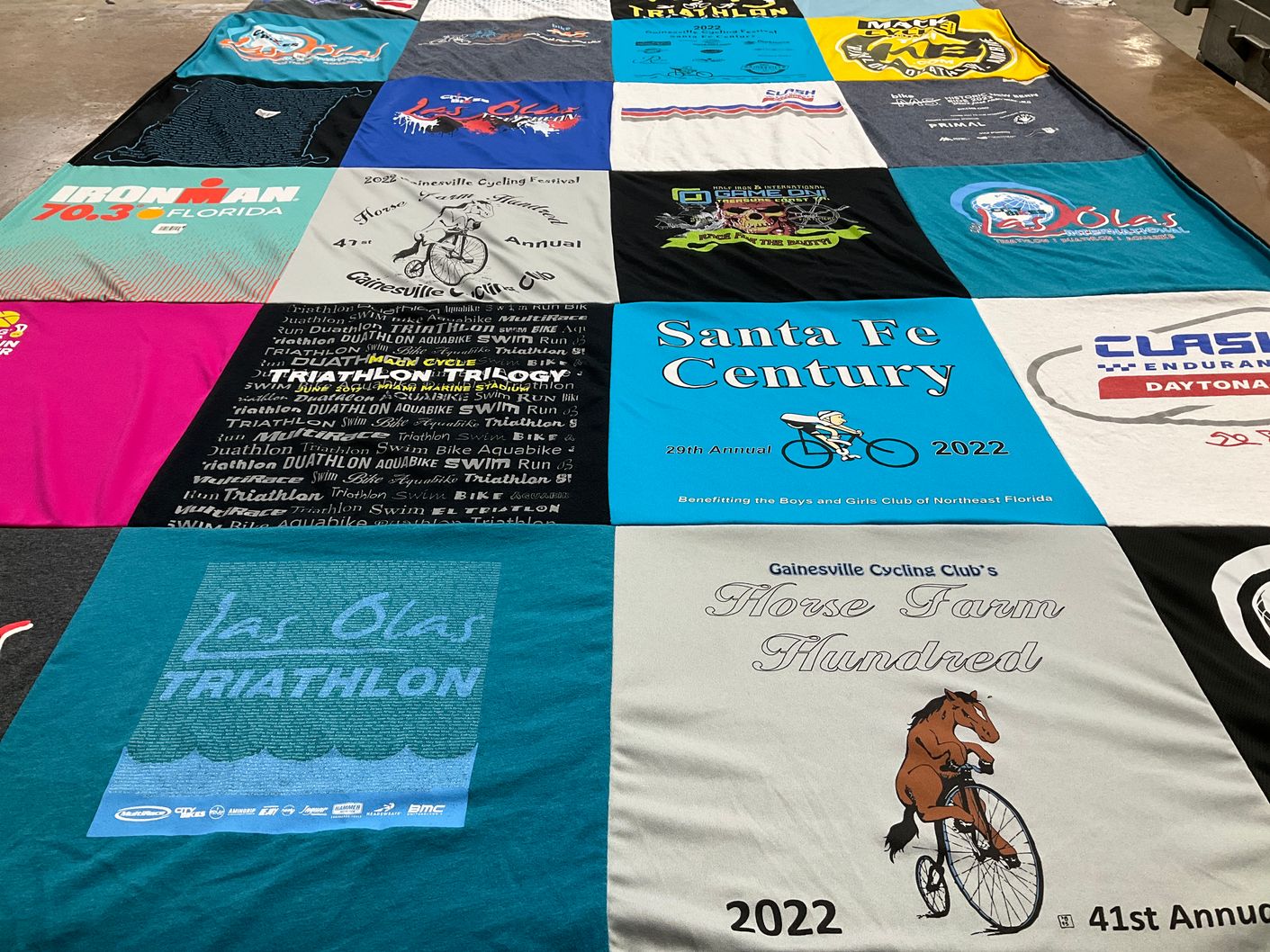 T-shirt quilt with cycling, triathlon themes by RS from FL