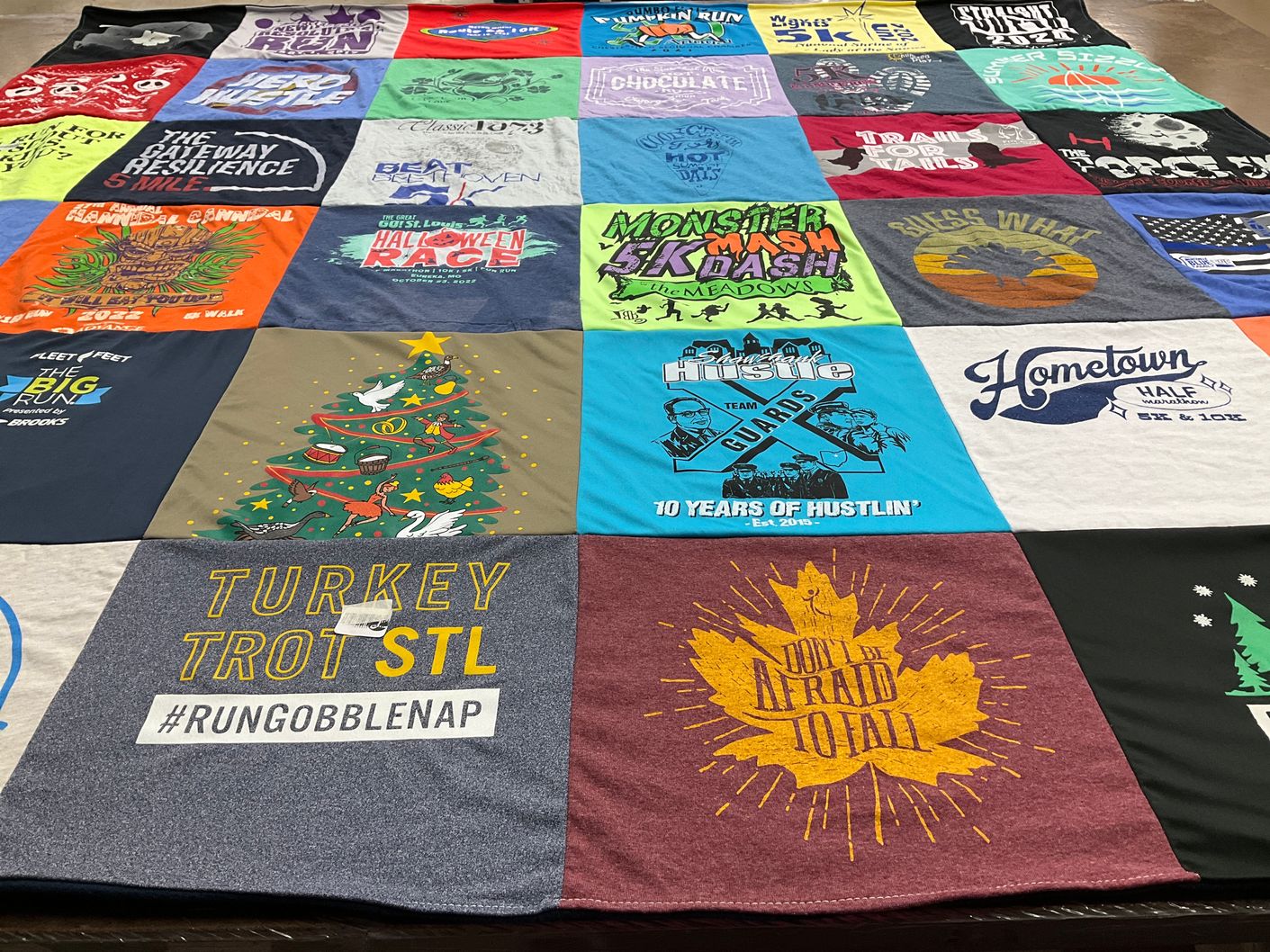 T-shirt quilt with running, festivals themes by Ruth from MO