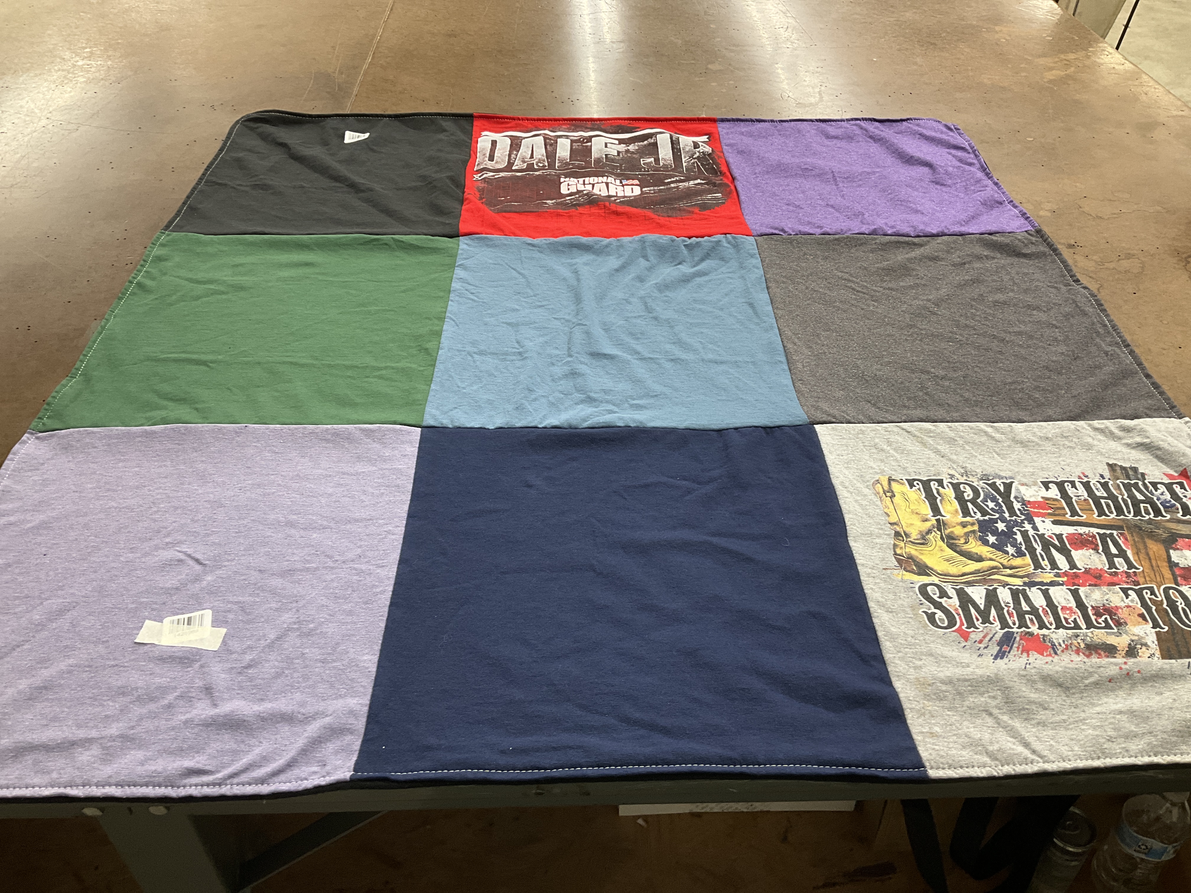 T-shirt quilt with sports, travel themes by Elaine from NY