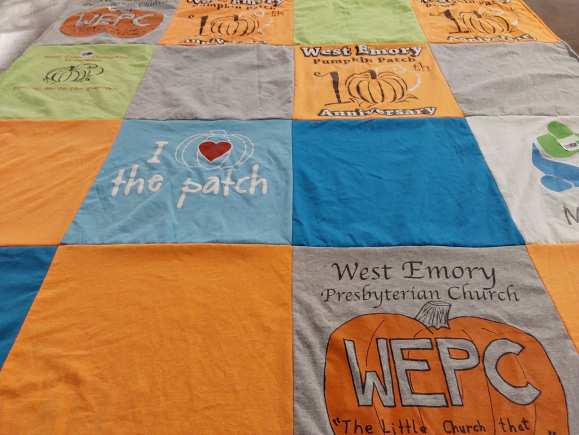 T-shirt quilt with community, church activities themes by Linda from TN