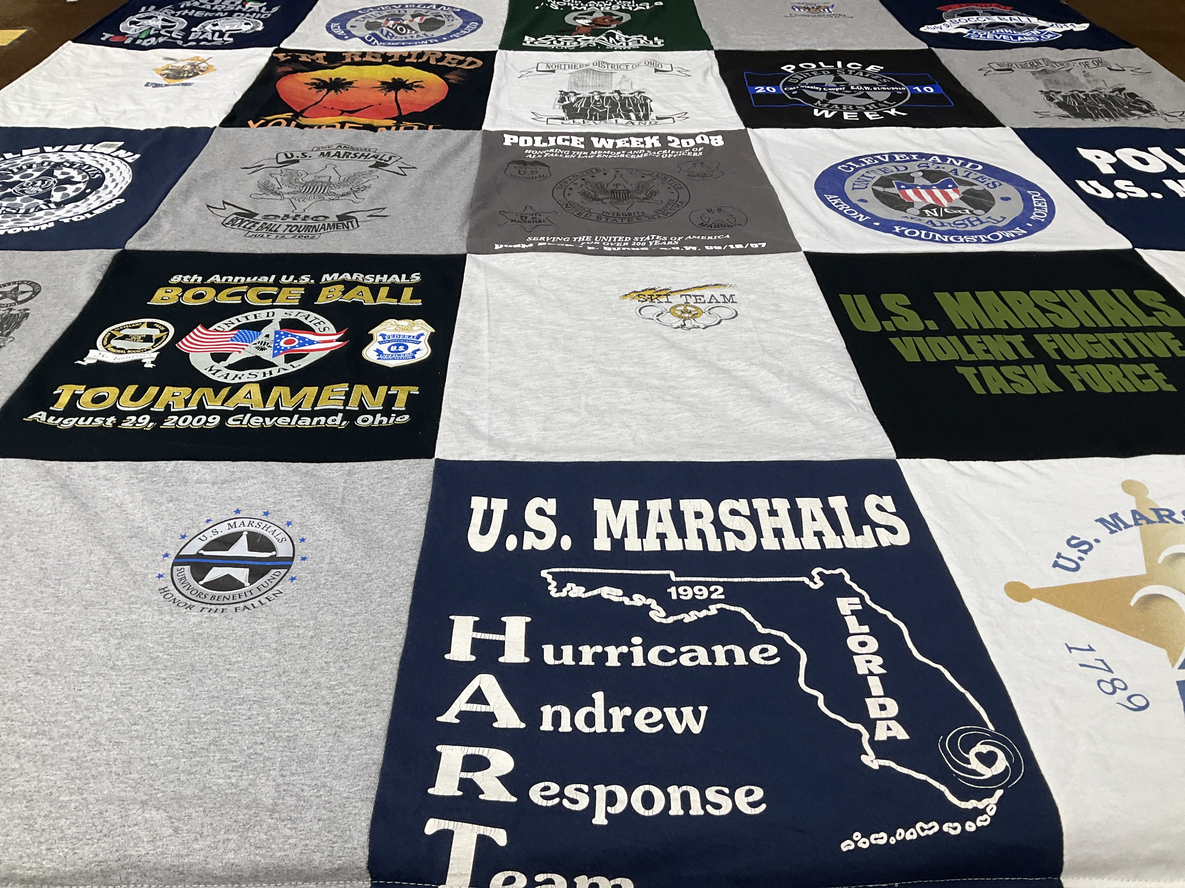 T-shirt quilt with law enforcement, sports themes by Donna from PA