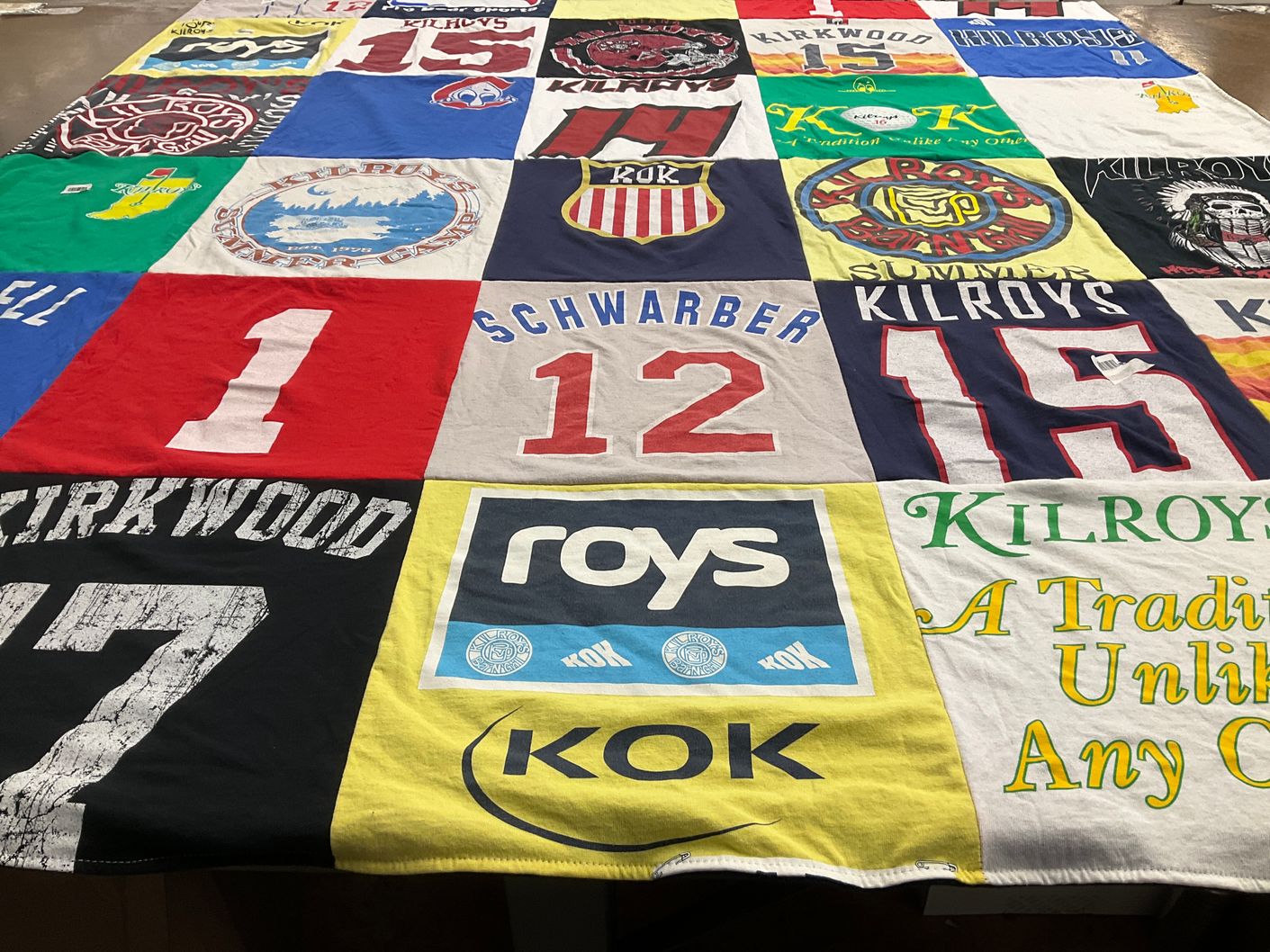 T-shirt quilt with sports, restaurants themes by Jane from OH
