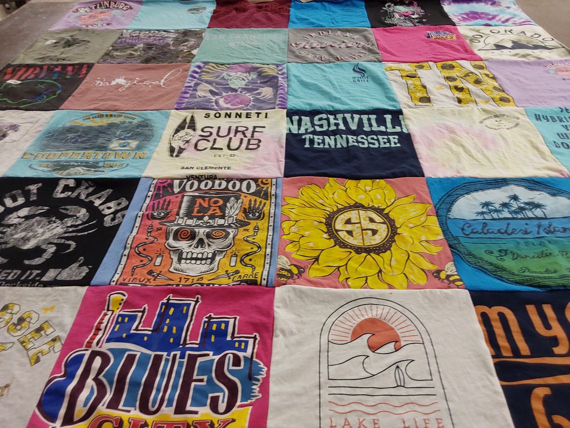 T-shirt quilt with travel, music themes by Kelli from IN