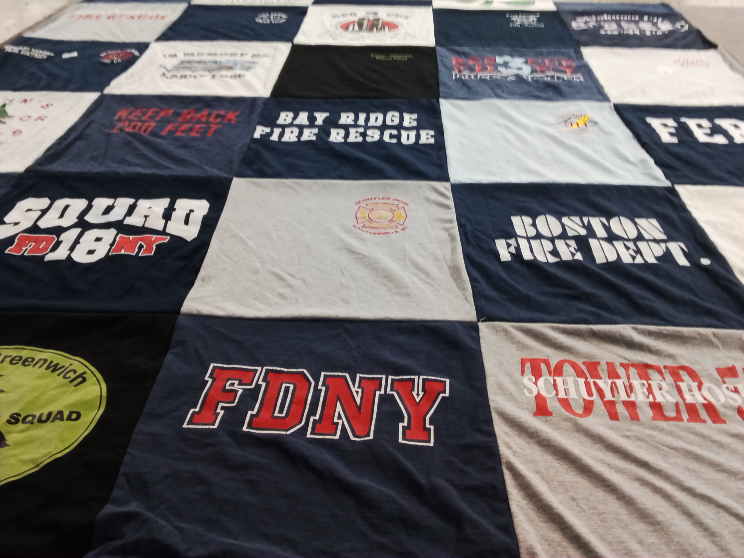 T-shirt quilt with firefighting, rescue services themes by Pamela from NY