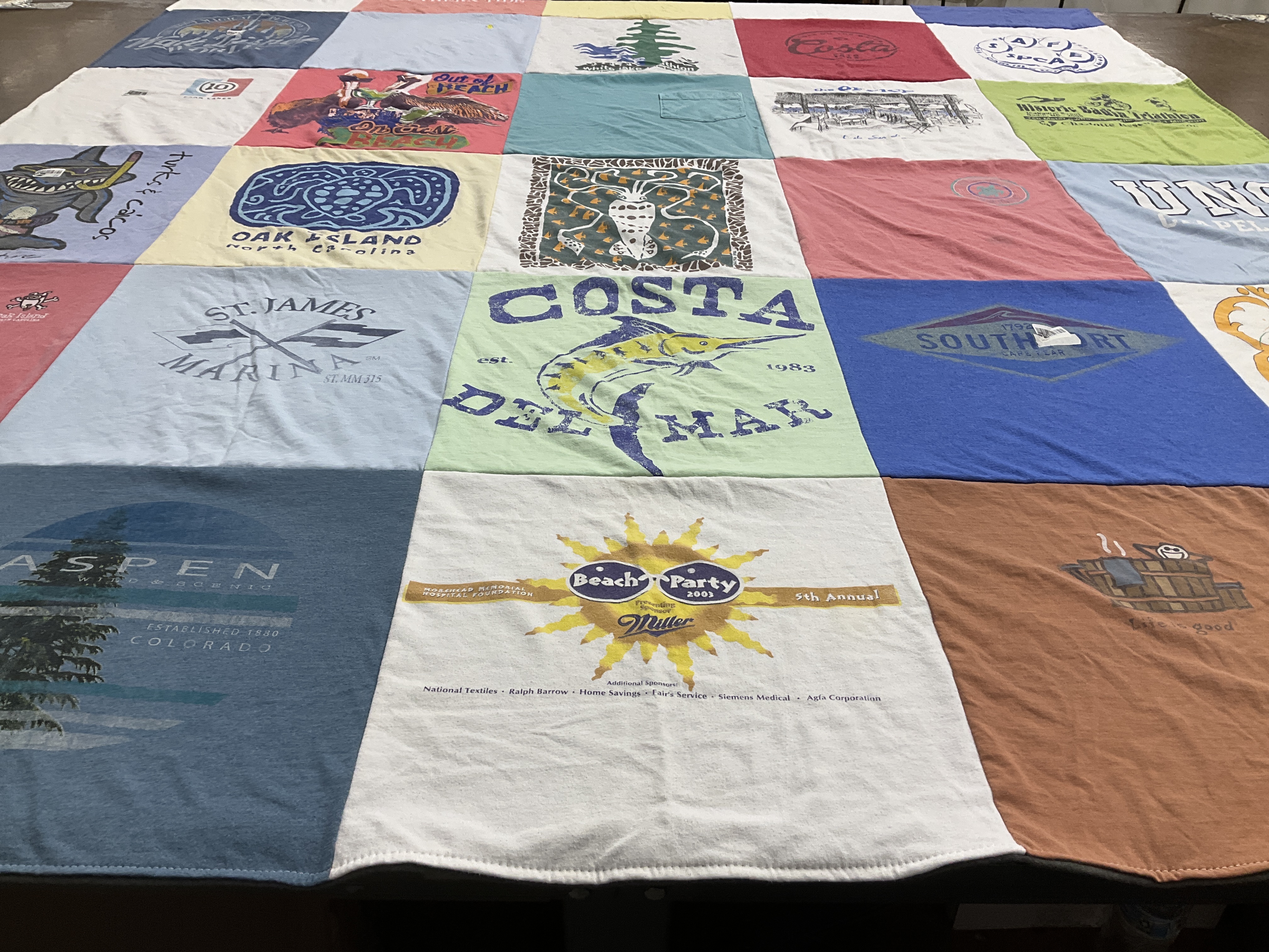 T-shirt quilt with beach, skiing themes by Margaret from NC