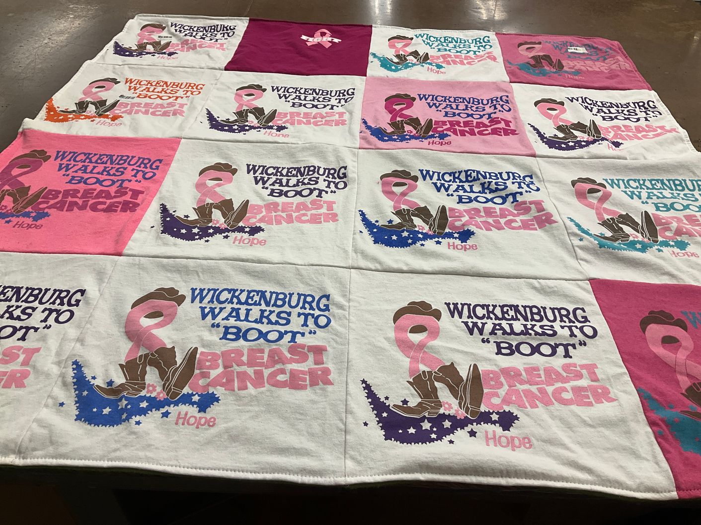 T-shirt quilt with breast cancer awareness, community events themes by Ruth from AZ