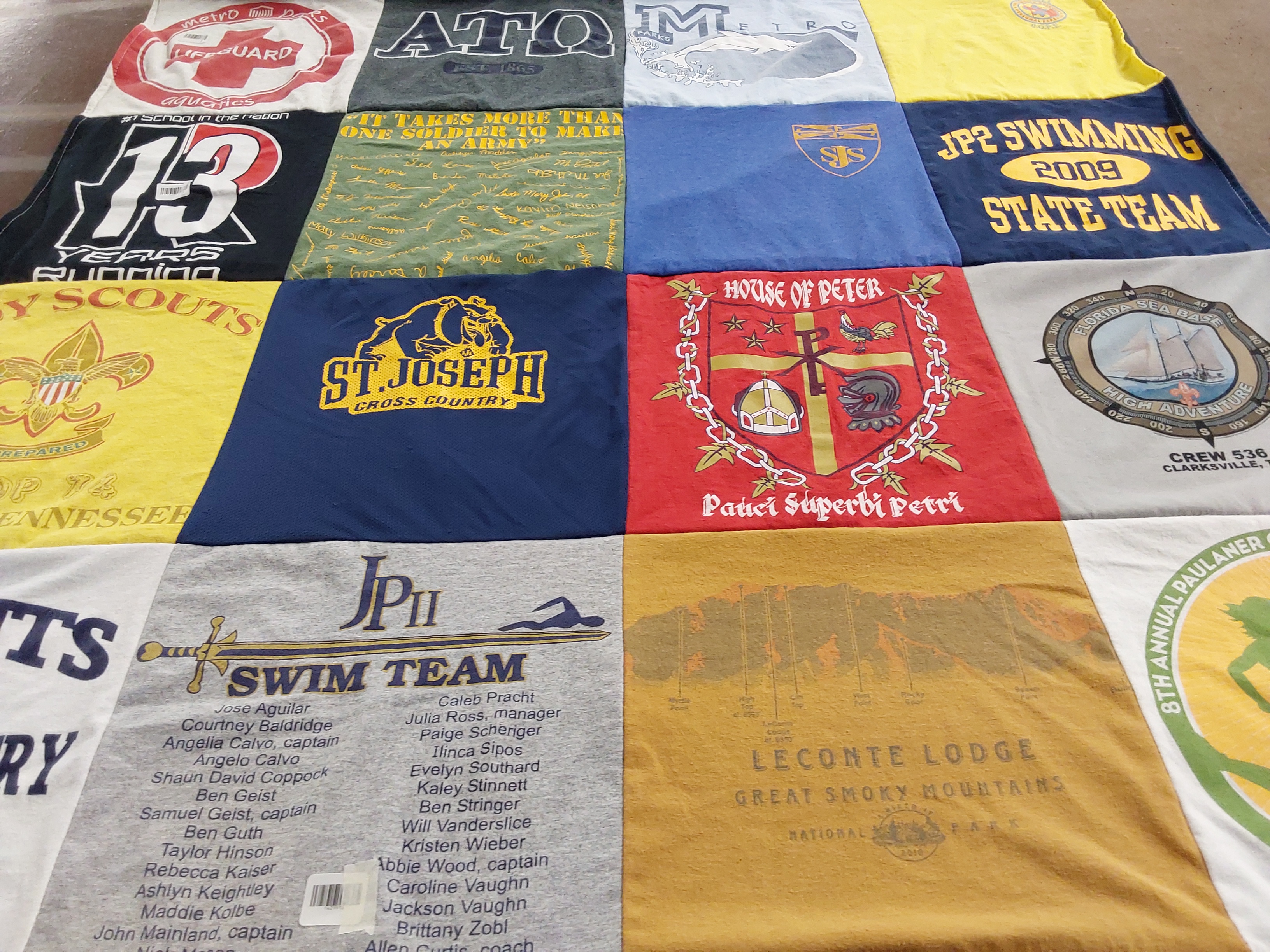 T-shirt quilt featuring jp ii swim team, st joseph cross country by Anne from TN